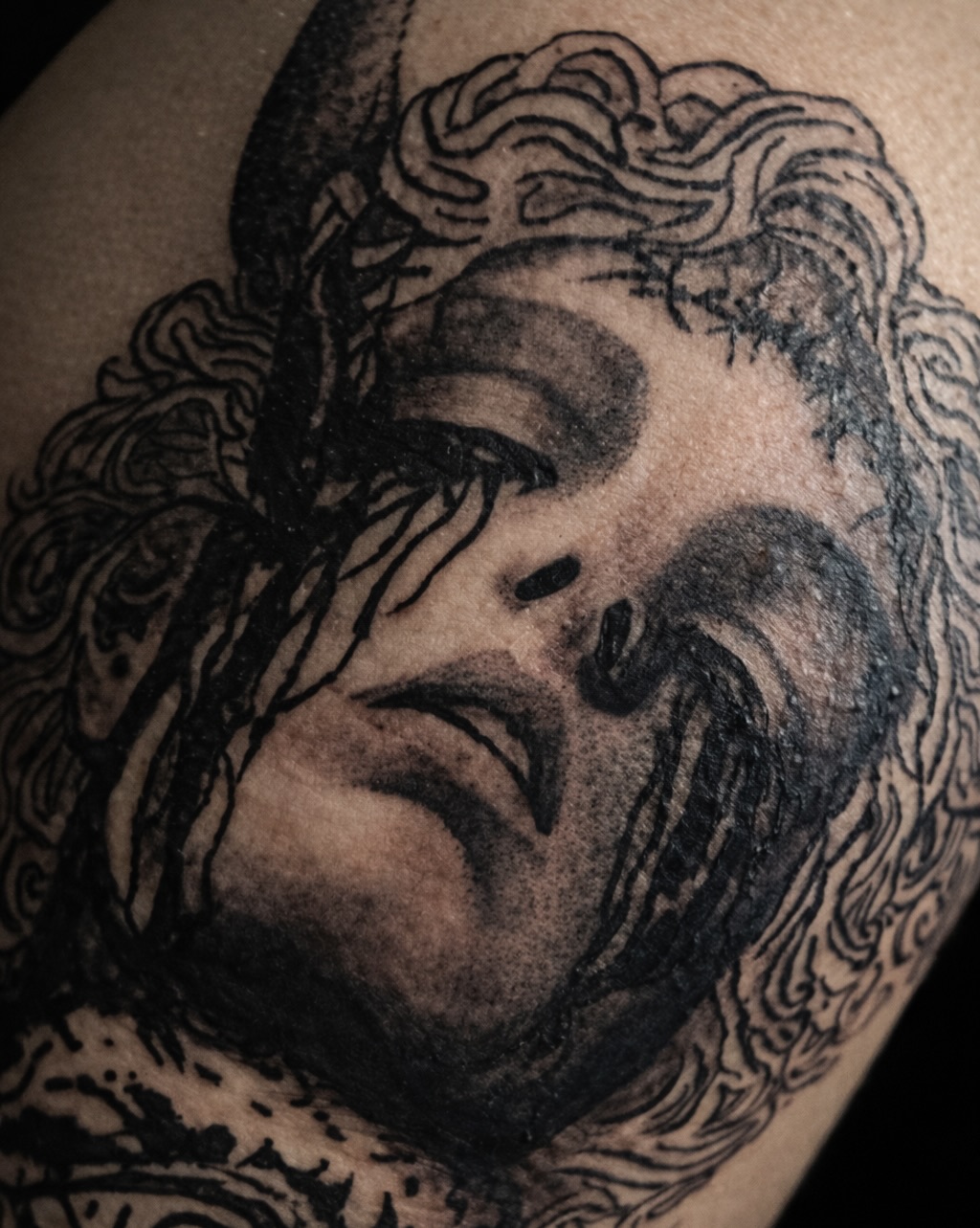 Weeping woman's face realism tattoo on the shoulder by K Valentine