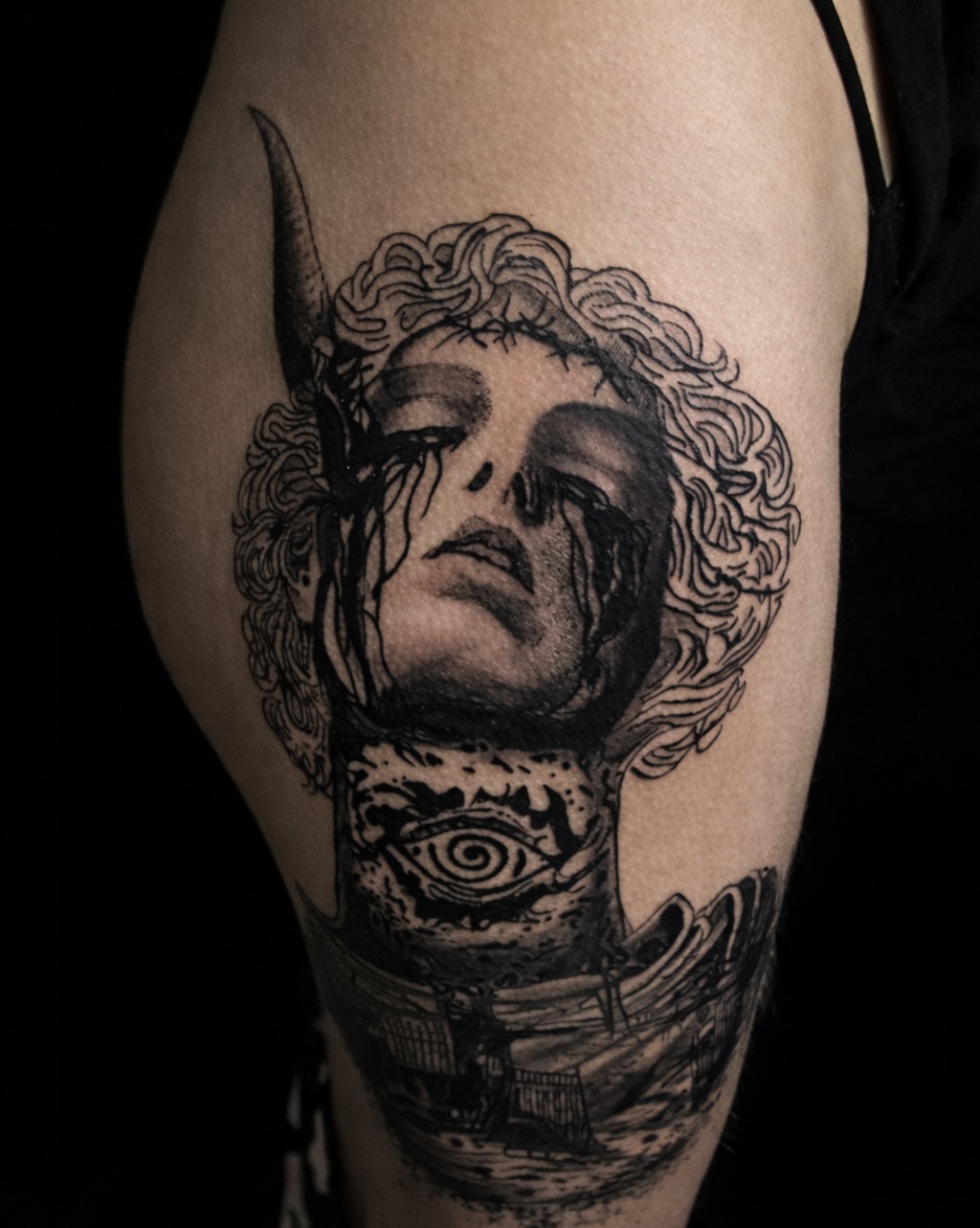Gargoyle face with eye and landscape realism tattoo on the forearm by K Valentine