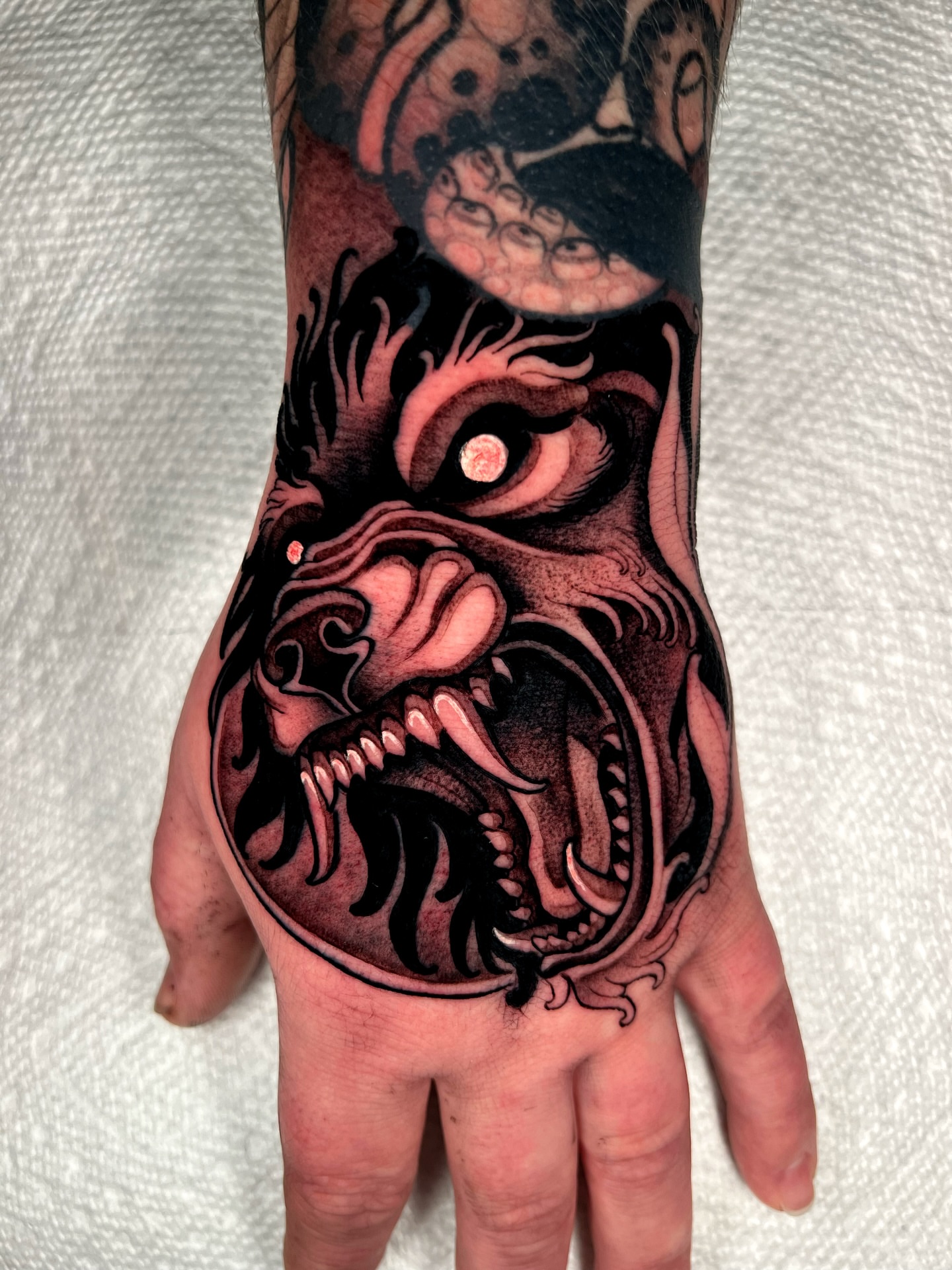 Demon American traditional tattoo on the hand by Skyler Miller
