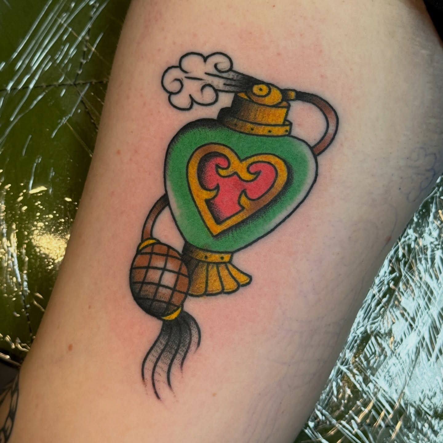 Candy bomb American traditional tattoo on the forearm by Traddy Maddie ๐
