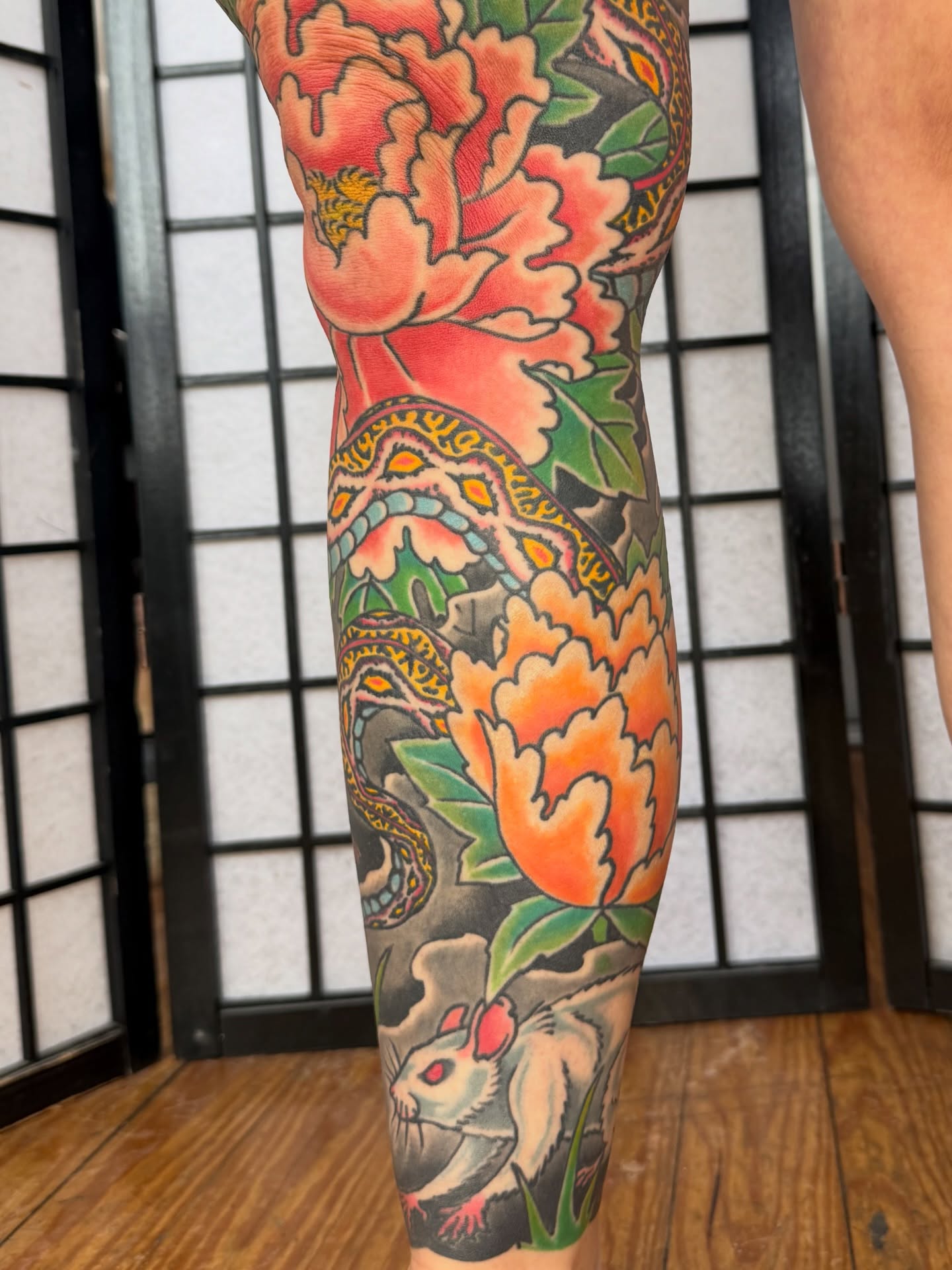 Peony and rat American traditional tattoo on the forearm by Zak Colburn