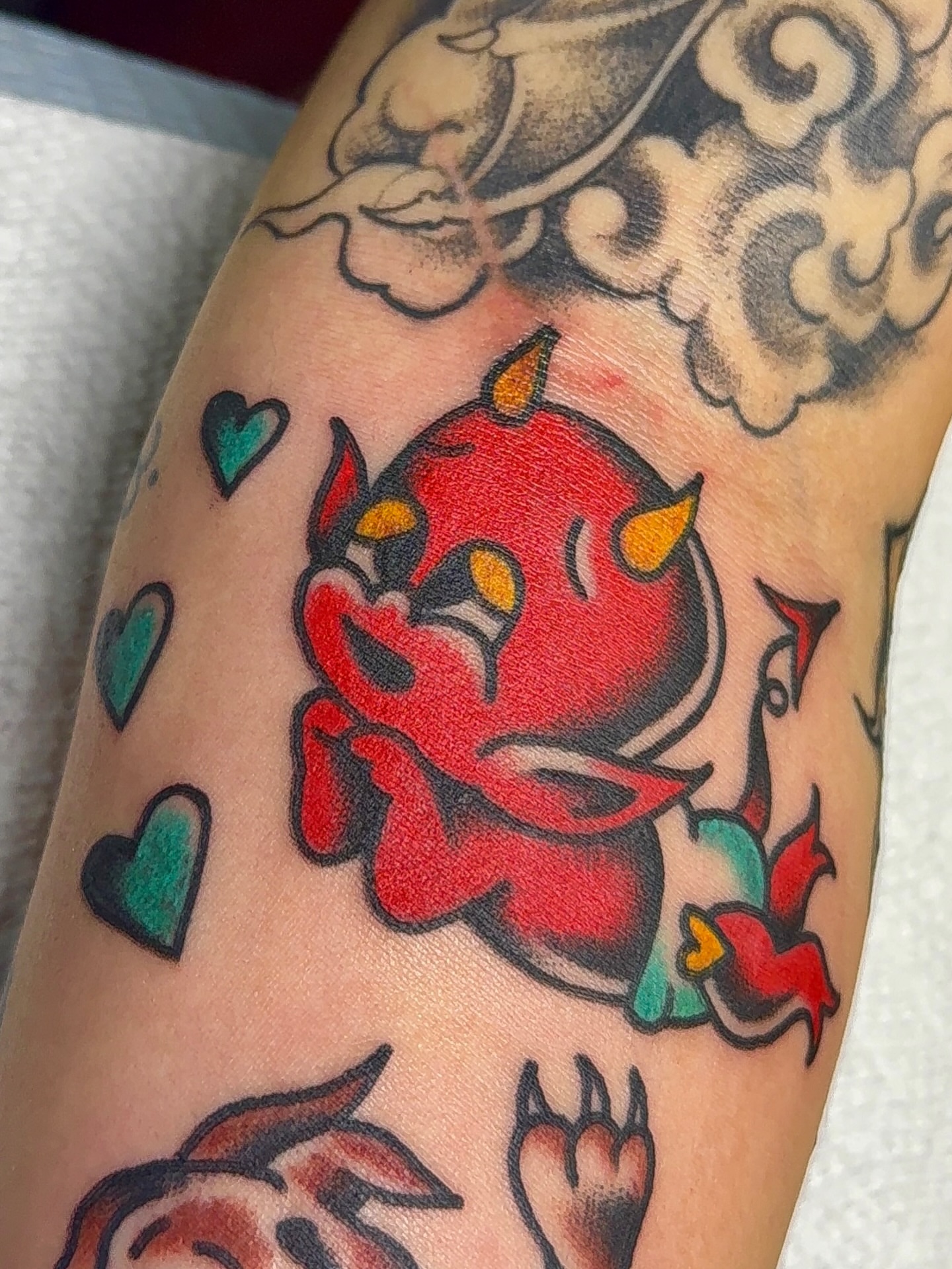 Red devil American traditional tattoo on the forearm by VAY