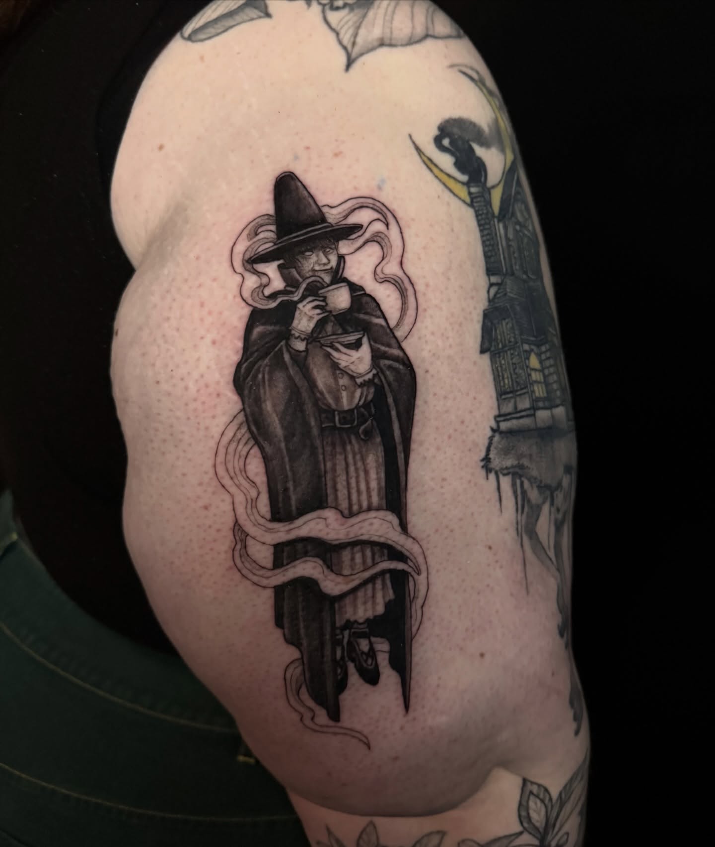 Witch black and grey tattoo on the shoulder by Caleb Gesicki
