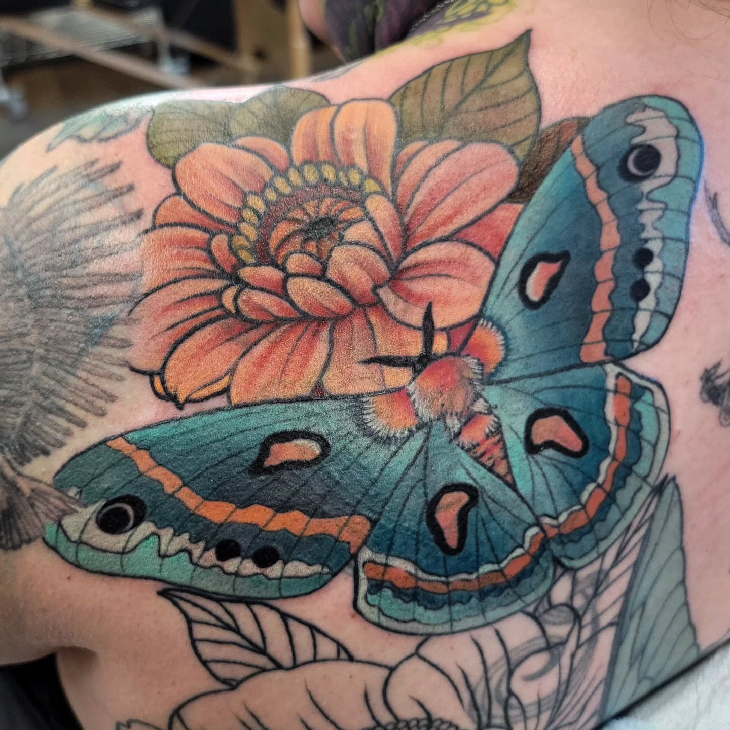 Butterfly and flower realism tattoo on the shoulder by Chantel Chan, Portland, Oregon