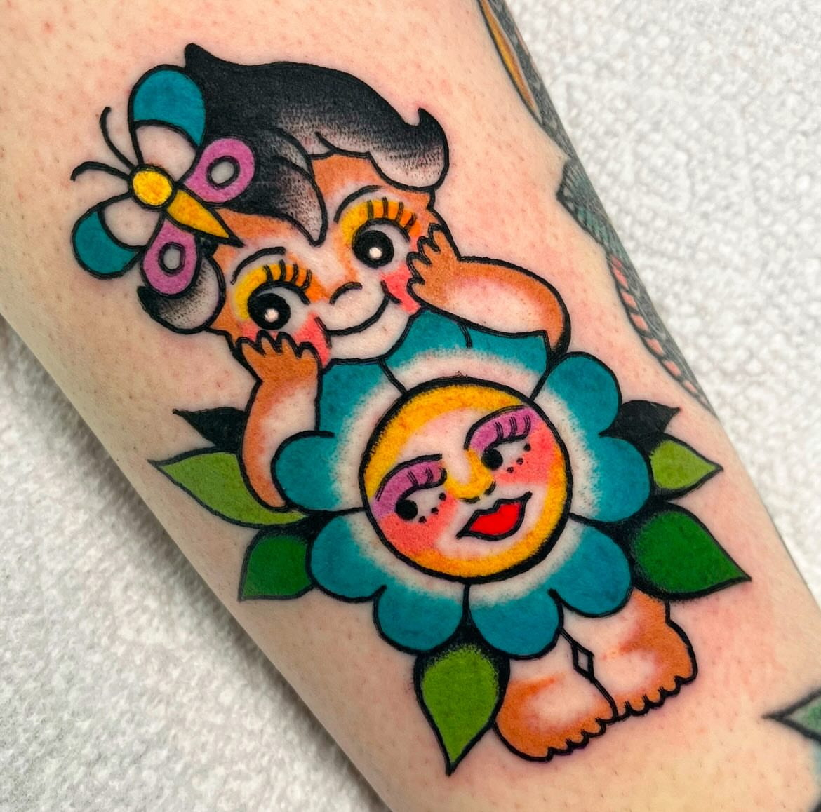 Child and sun American traditional tattoo on the forearm by ⭐️ Erin Bauer ⭐️