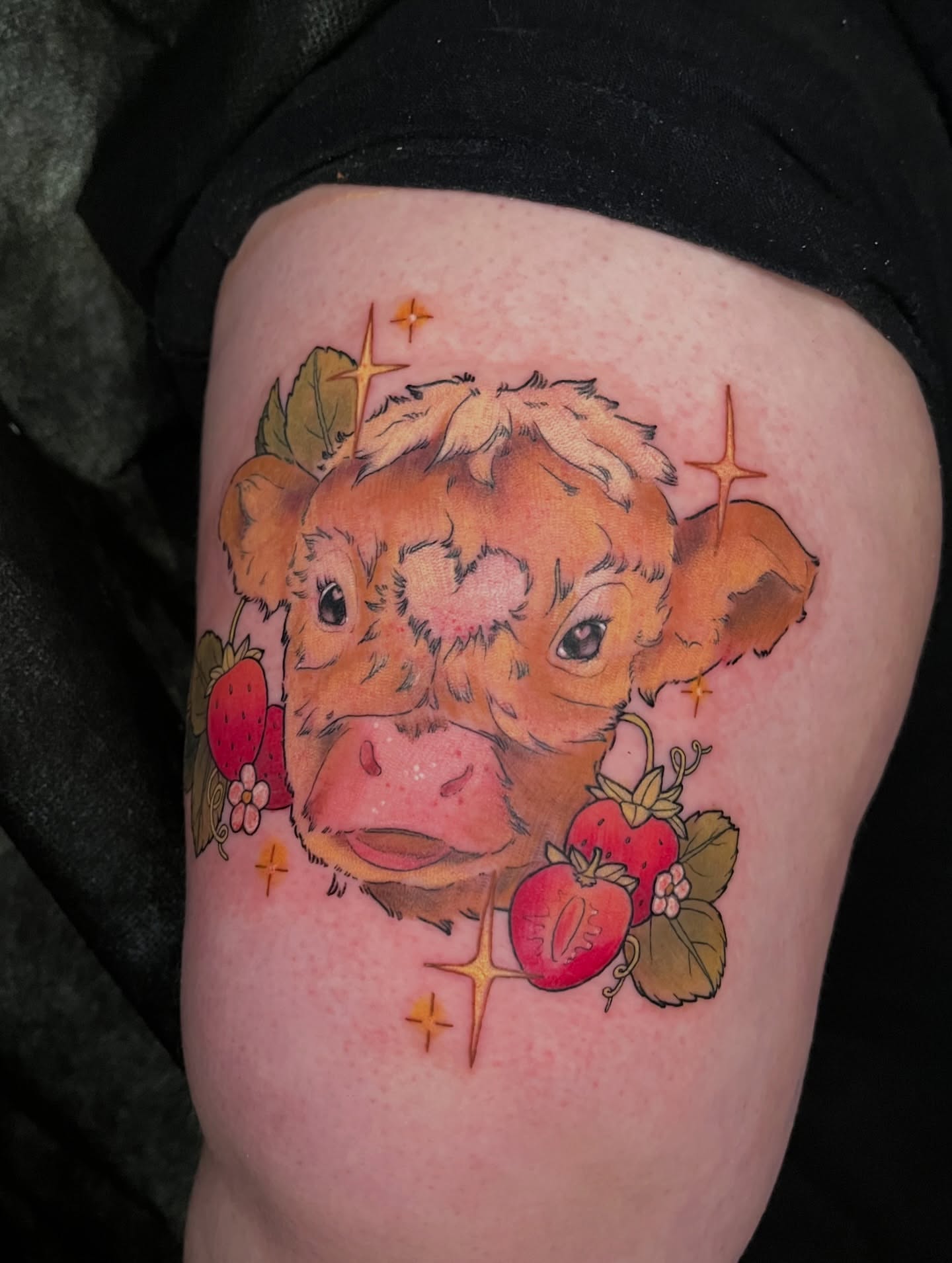 Cow and strawberries realism tattoo on the thigh by Summer Machelle, Orange, California