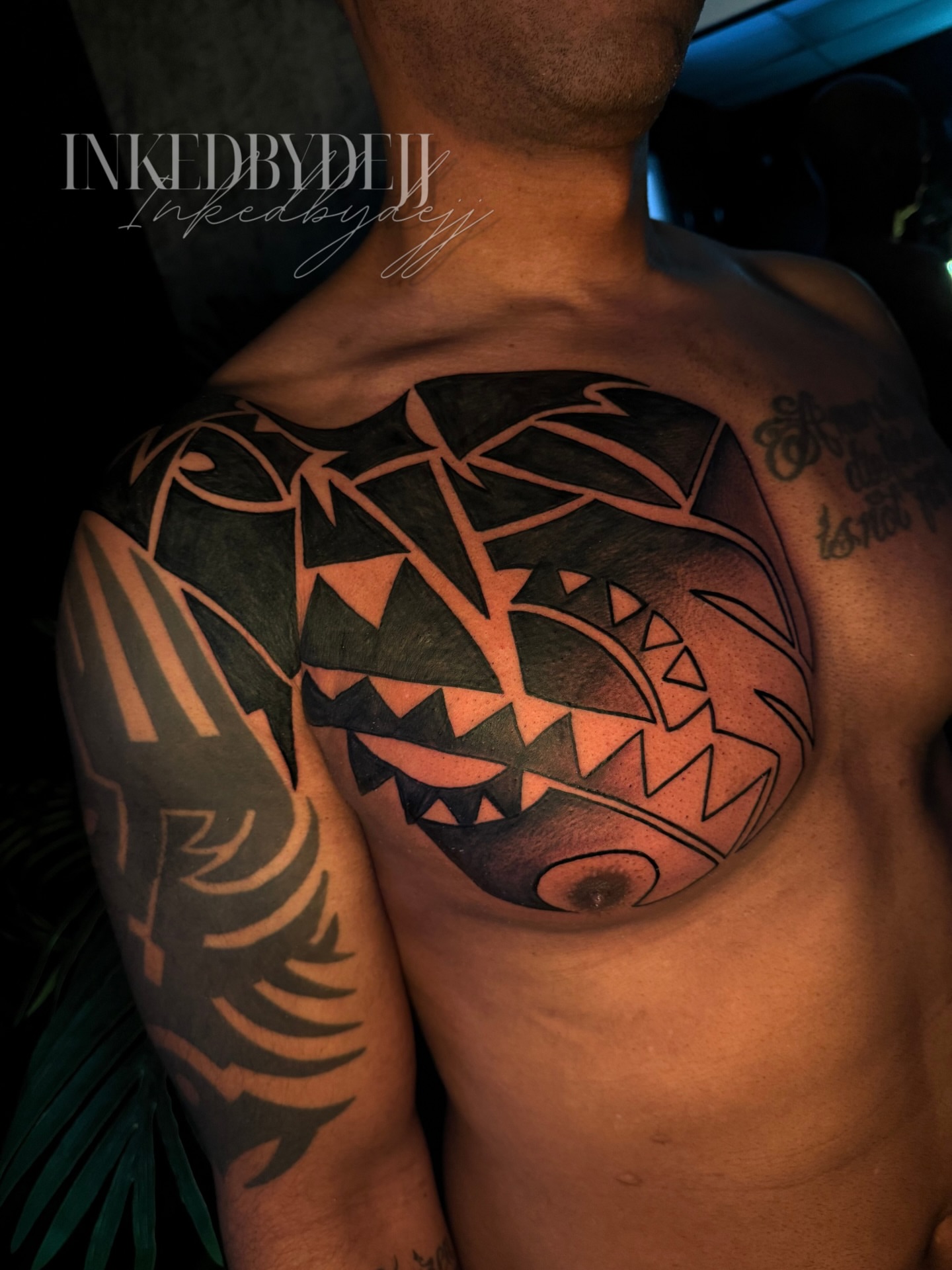 Geometric mask geometric tattoo on the chest by Inkedbydejj
