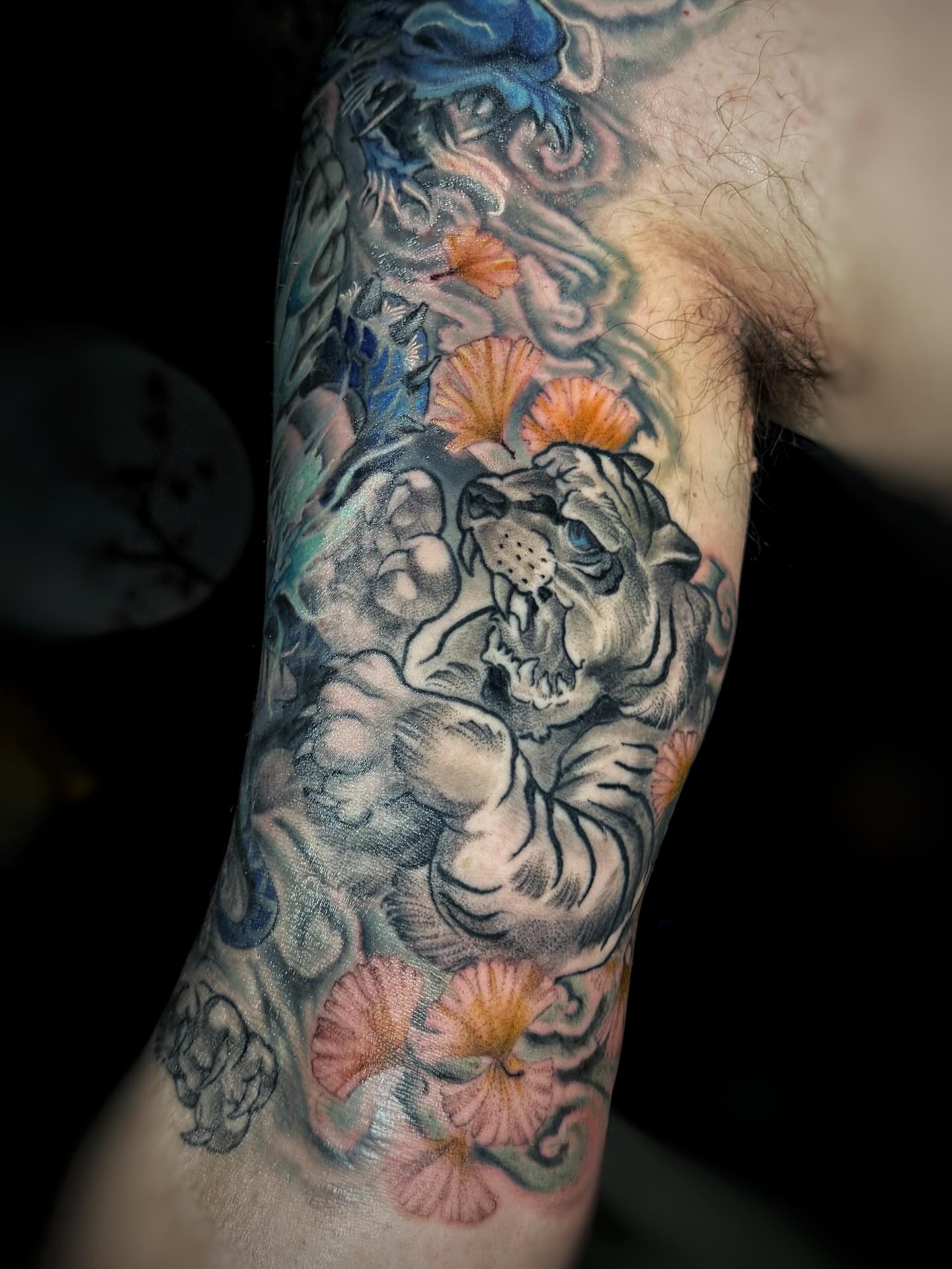 Tiger and flowers japanese irezumi tattoo on the forearm by Anna Saveria