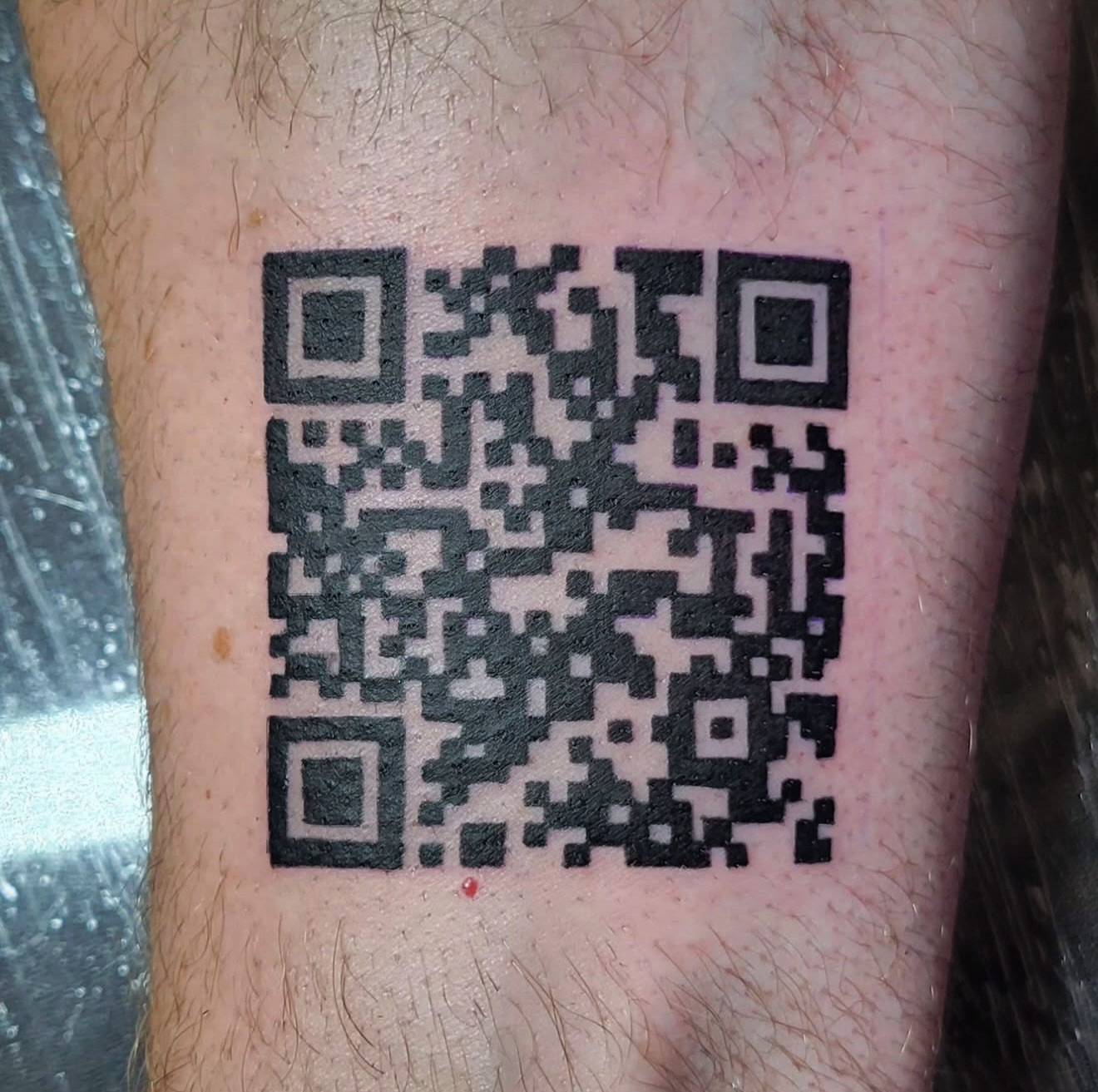 Qr code dotwork tattoo on the forearm by Beto Tats, Round Rock, Texas