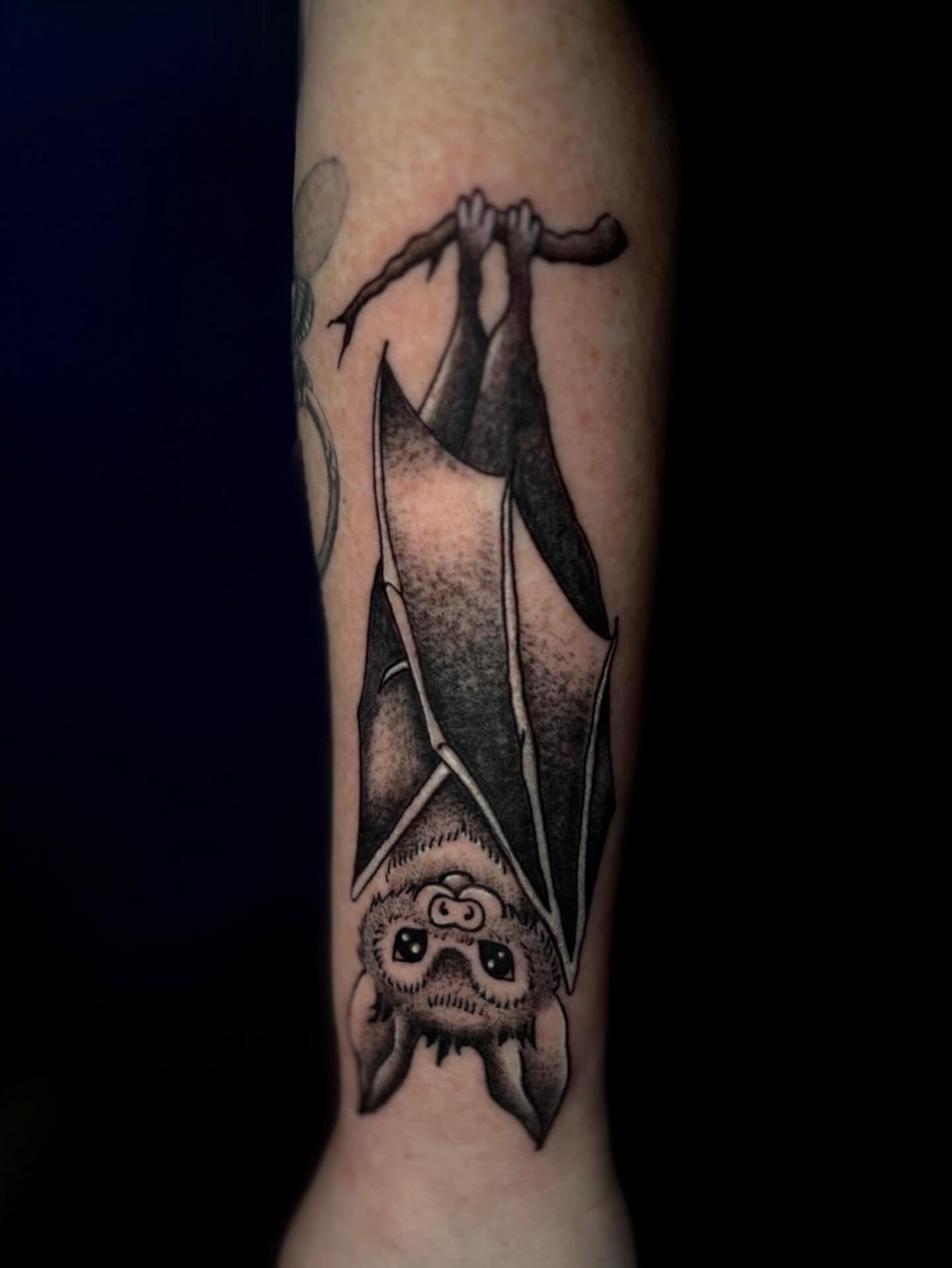 Bat black and grey tattoo on the forearm by Lee