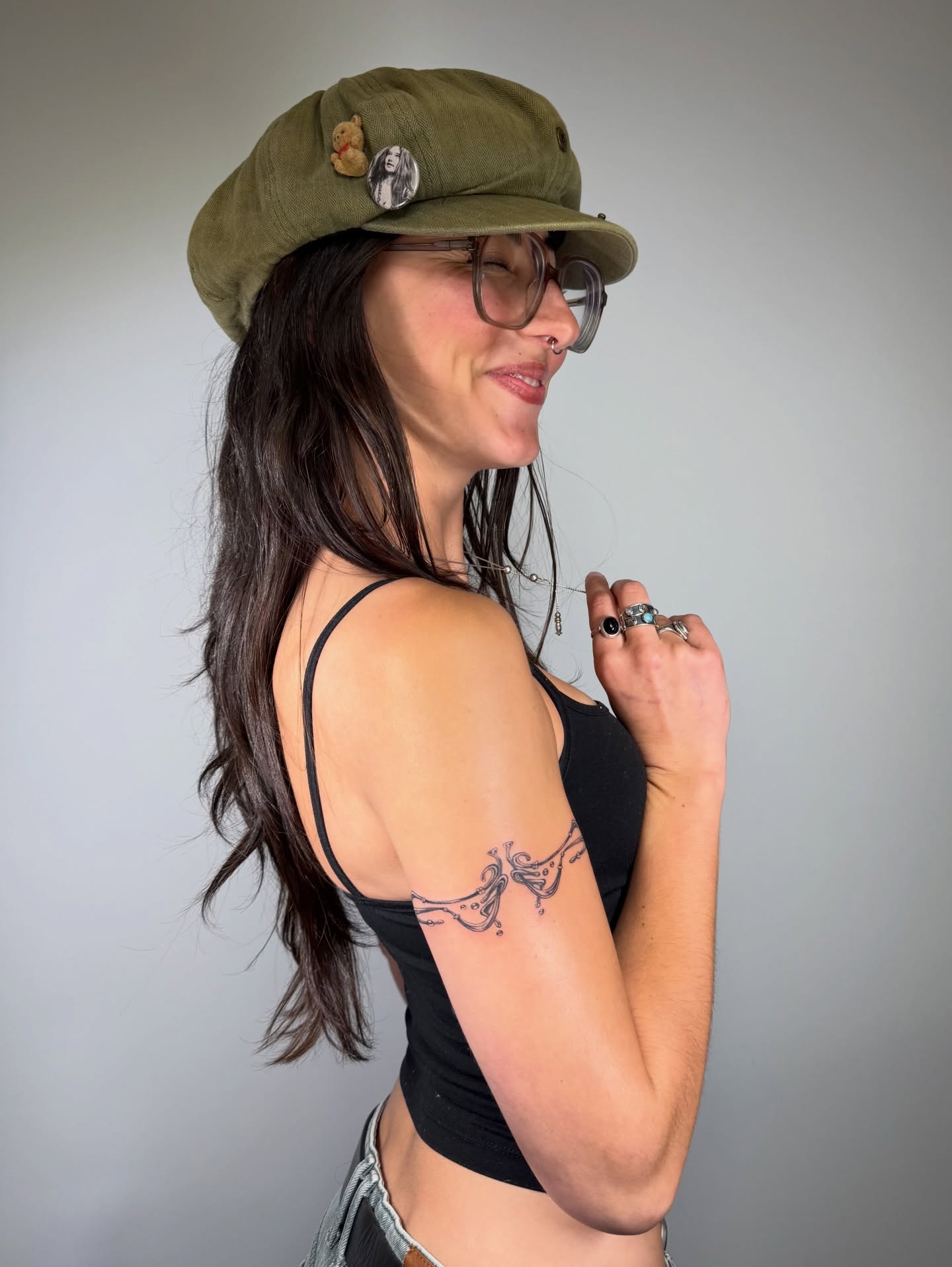 Tattooed arm black and grey tattoo on the upper arm by Lauren ๐