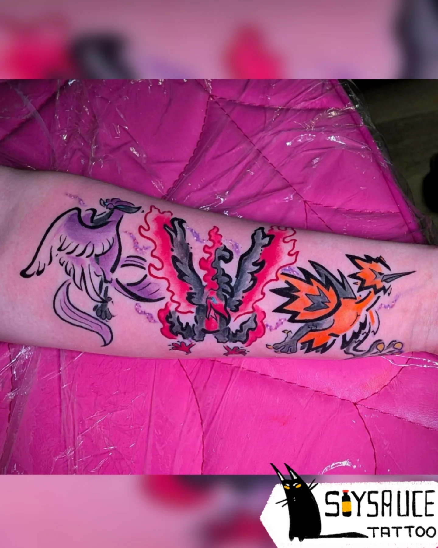 Dragons new school tattoo on the forearm by Zoe Aucoin