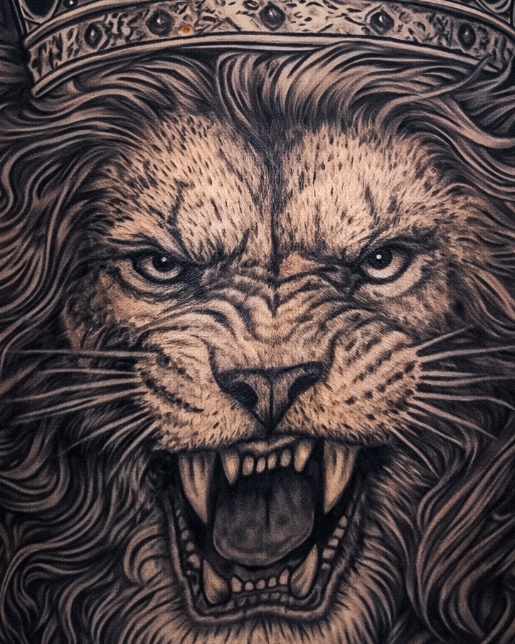 Roaring lion with crown realism tattoo by Mak$ Brand