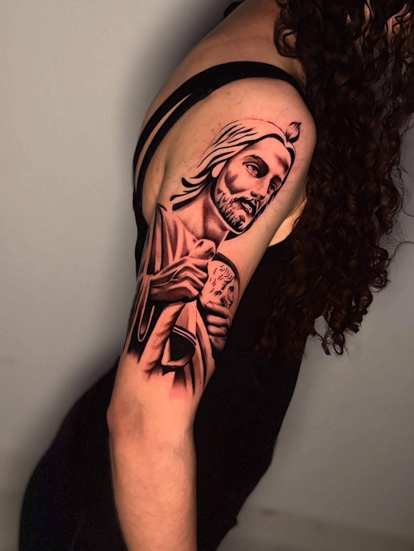 Religious figure realism tattoo on the shoulder by InkbyCasillas