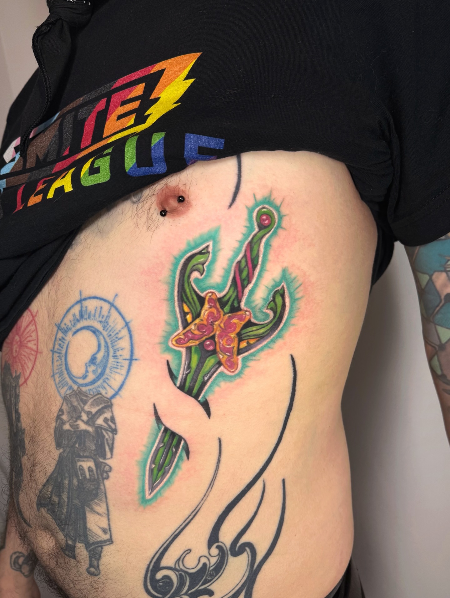 Flower and butterfly new school tattoo on the ribs by Franky A Bonifacio, Seattle, Washington