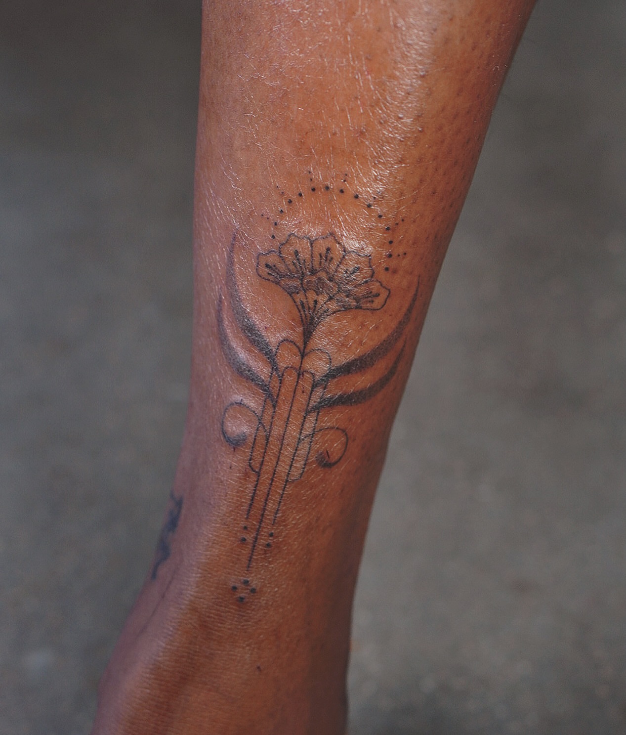 Flower and cross dotwork tattoo on the forearm by IVY K ༄ ATX Handpoke Artist