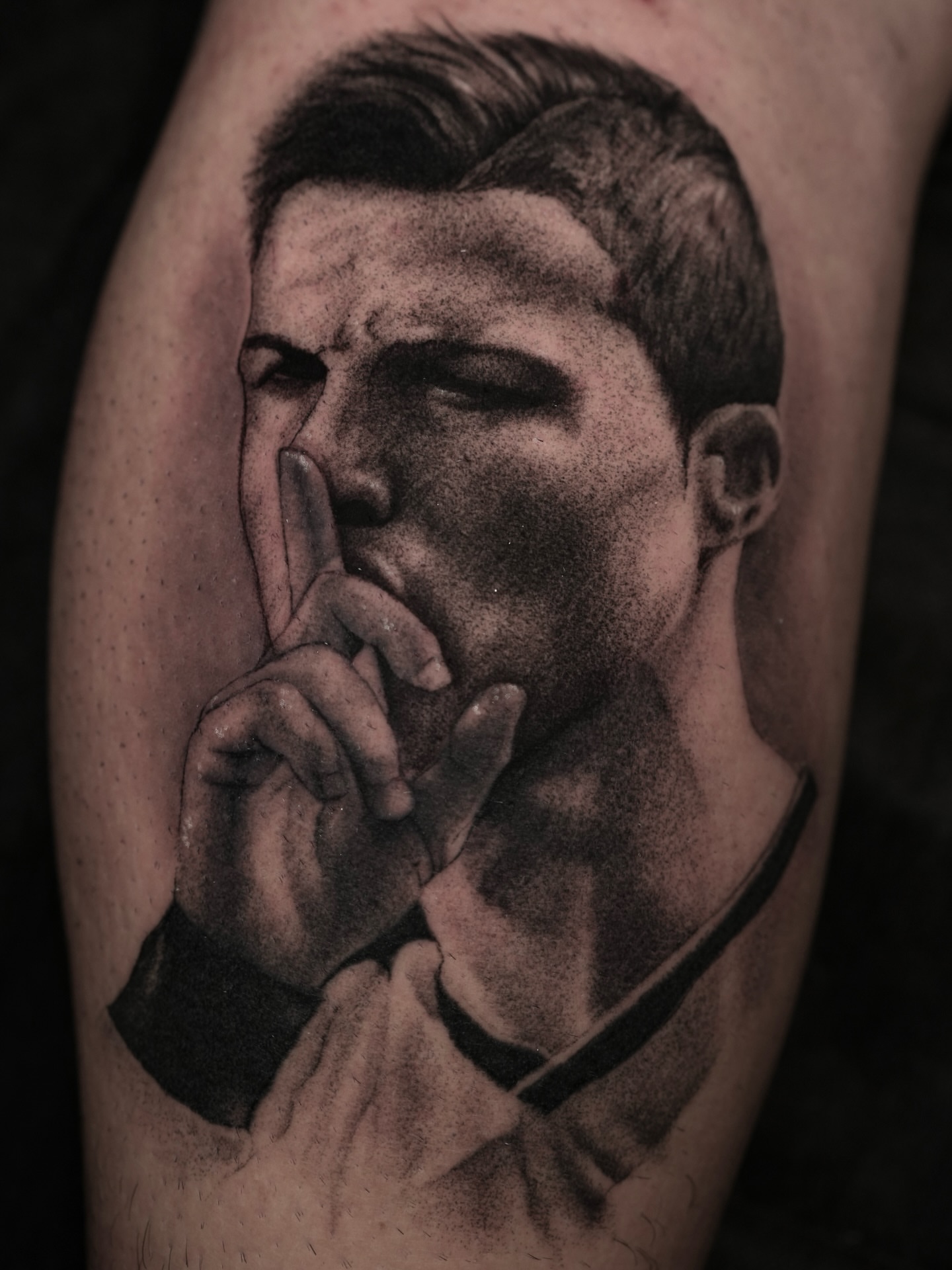 Man with finger on lips dotwork tattoo on the forearm by Dotwork