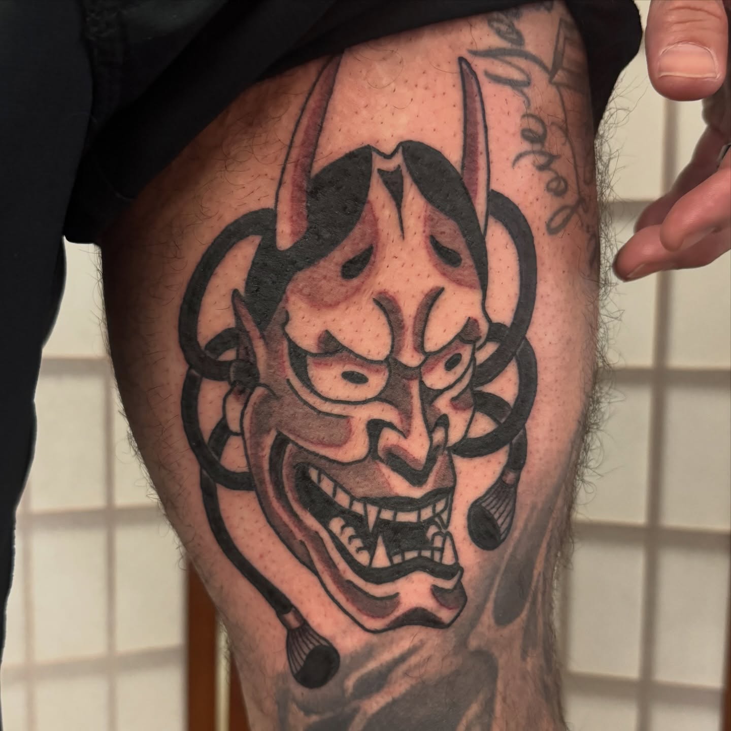 Demon mask japanese irezumi tattoo on the thigh by Dylan