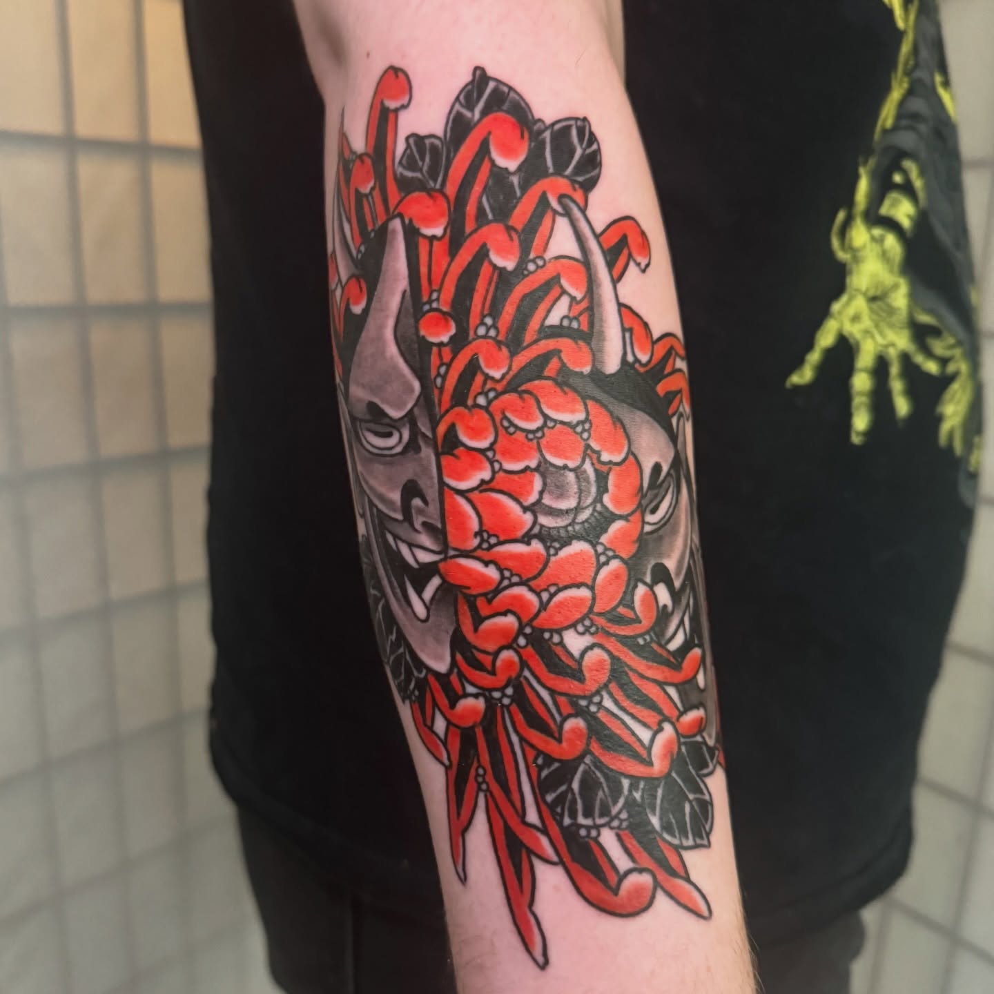 Cherry blossom and mask japanese irezumi tattoo on the forearm by Dylan
