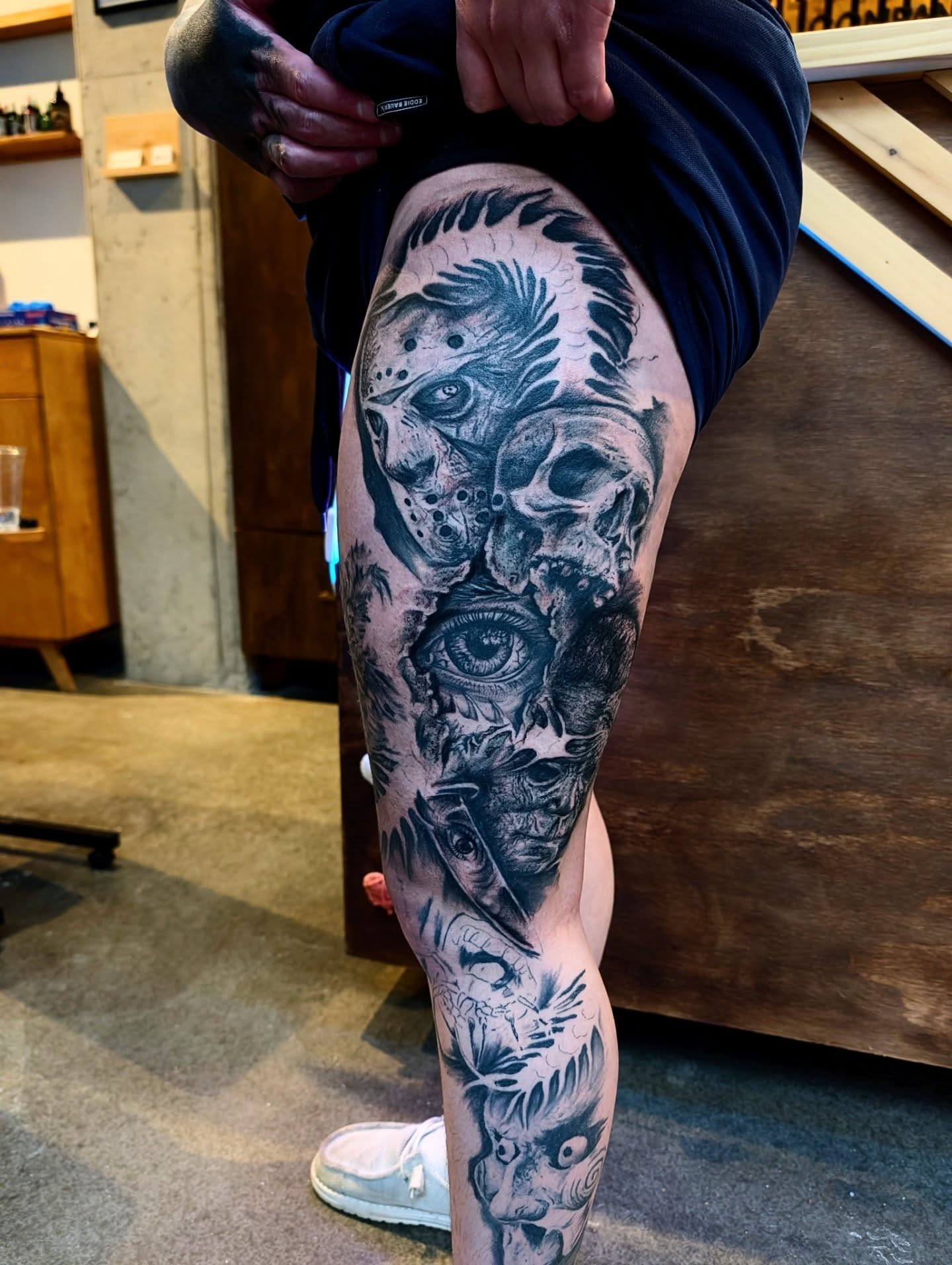 Eye and skull realism tattoo on the thigh by Drew King