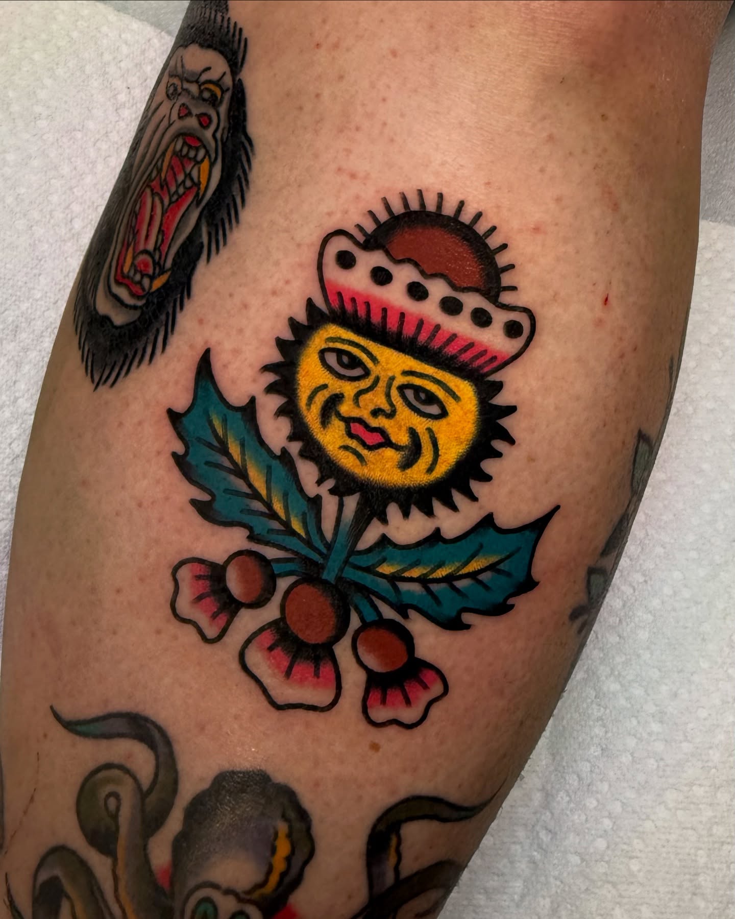Sunflower American traditional tattoo on the forearm by Zachary - Traditional Tattoo Artist