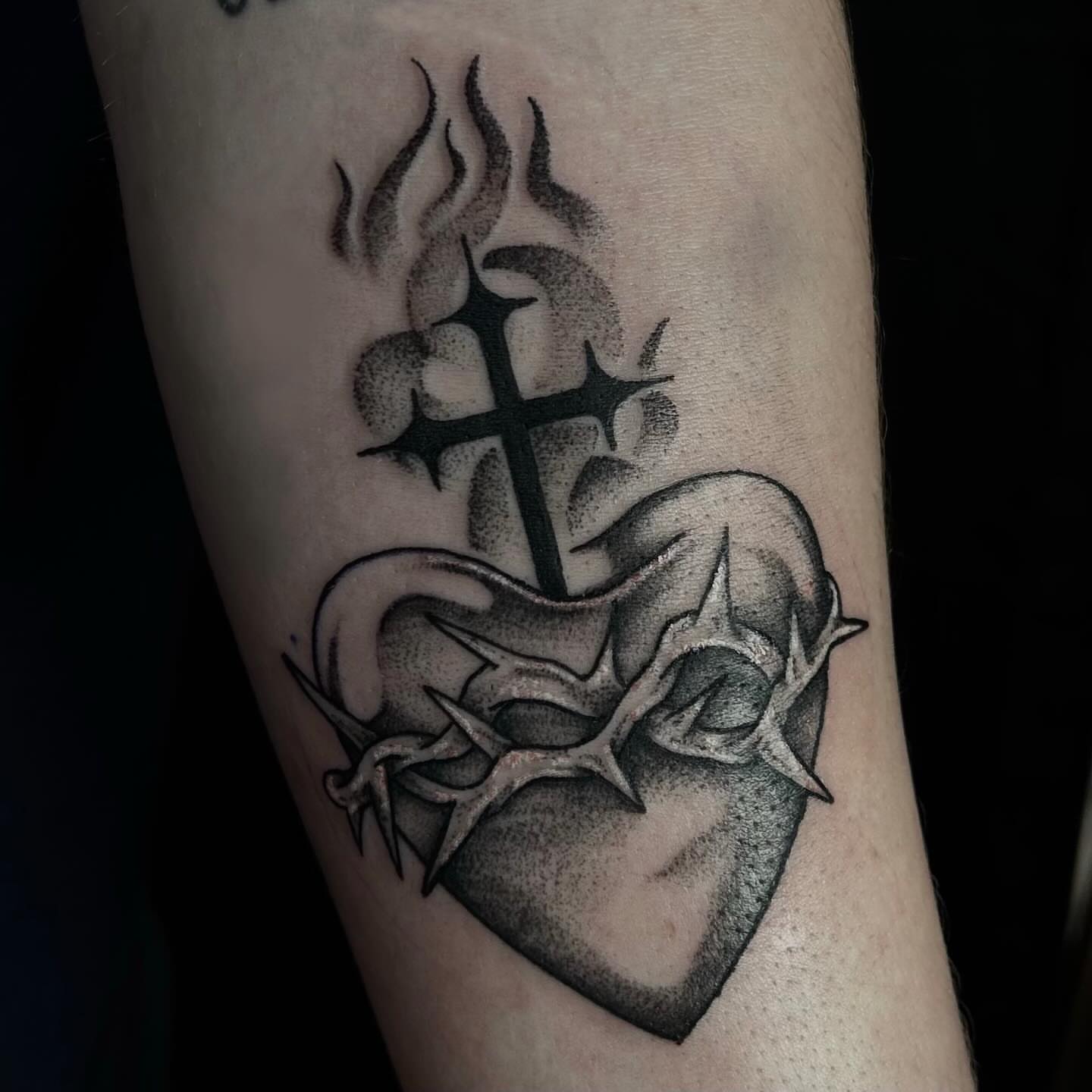 Heart with cross and thorns dotwork tattoo on the forearm by abby ☽ marie