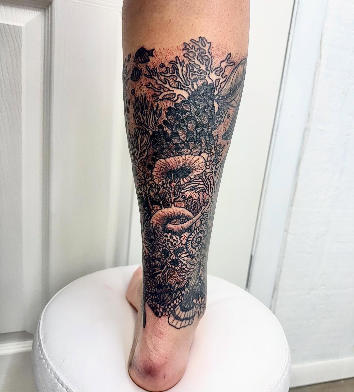 Abstract floral dotwork tattoo on the calf by Abby Ash, Belington, West Virginia