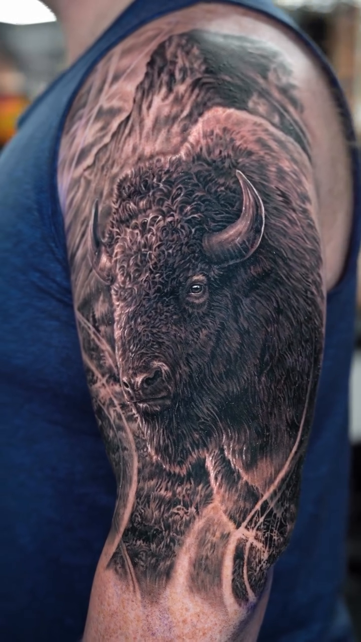 Bison in a mountain landscape realism tattoo by 𝒁𝒂𝒌 𝑷𝒆𝒓𝒓𝒚