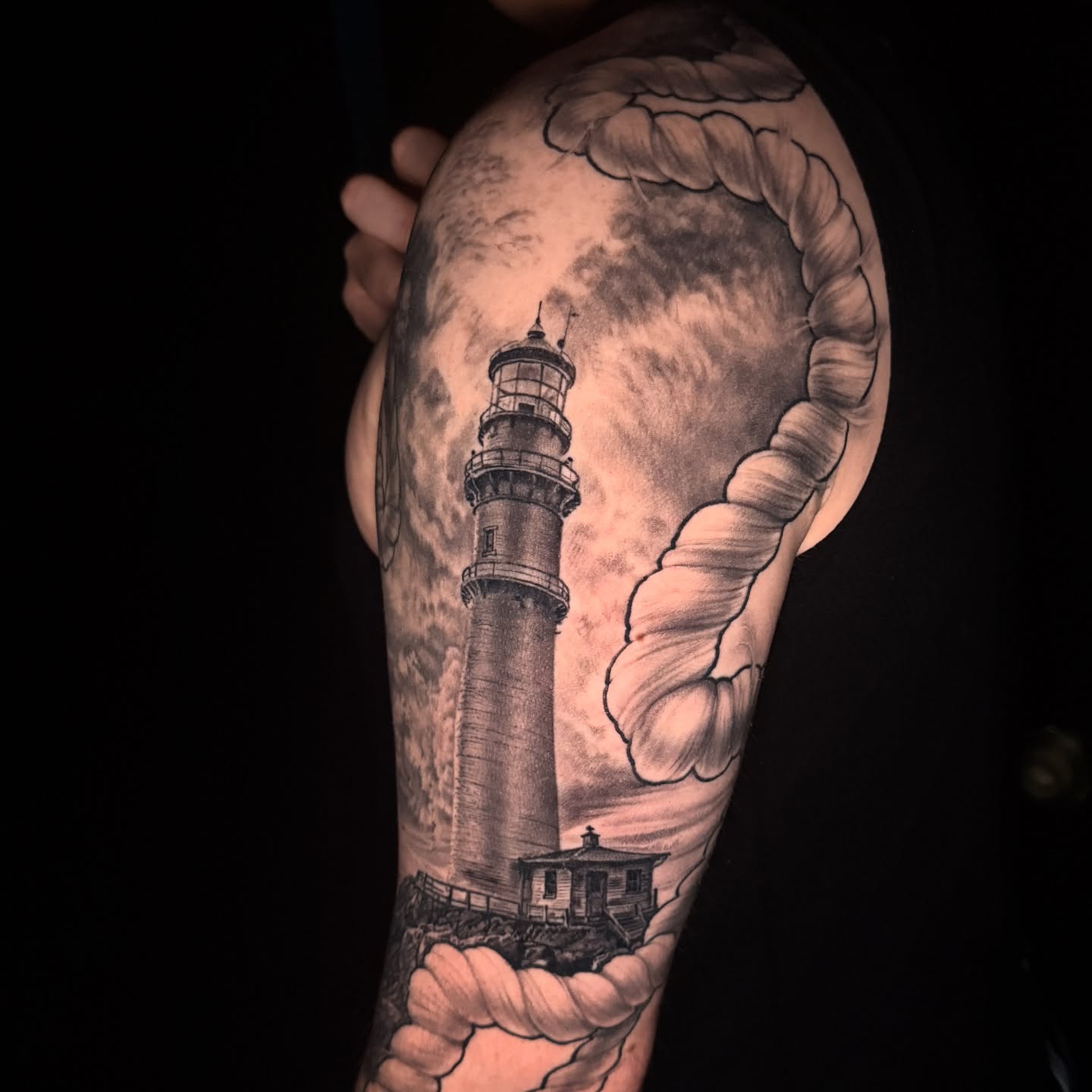 Lighthouse realism tattoo on the forearm by Jake Kirk