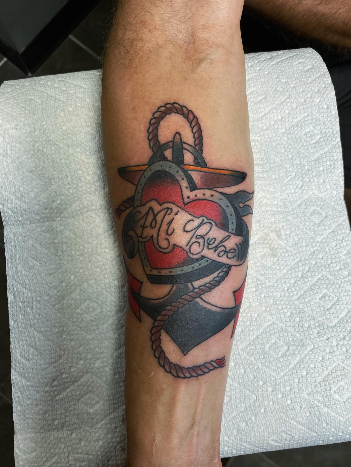 Anchor with heart American traditional tattoo on the forearm by Houston tattoo artist
