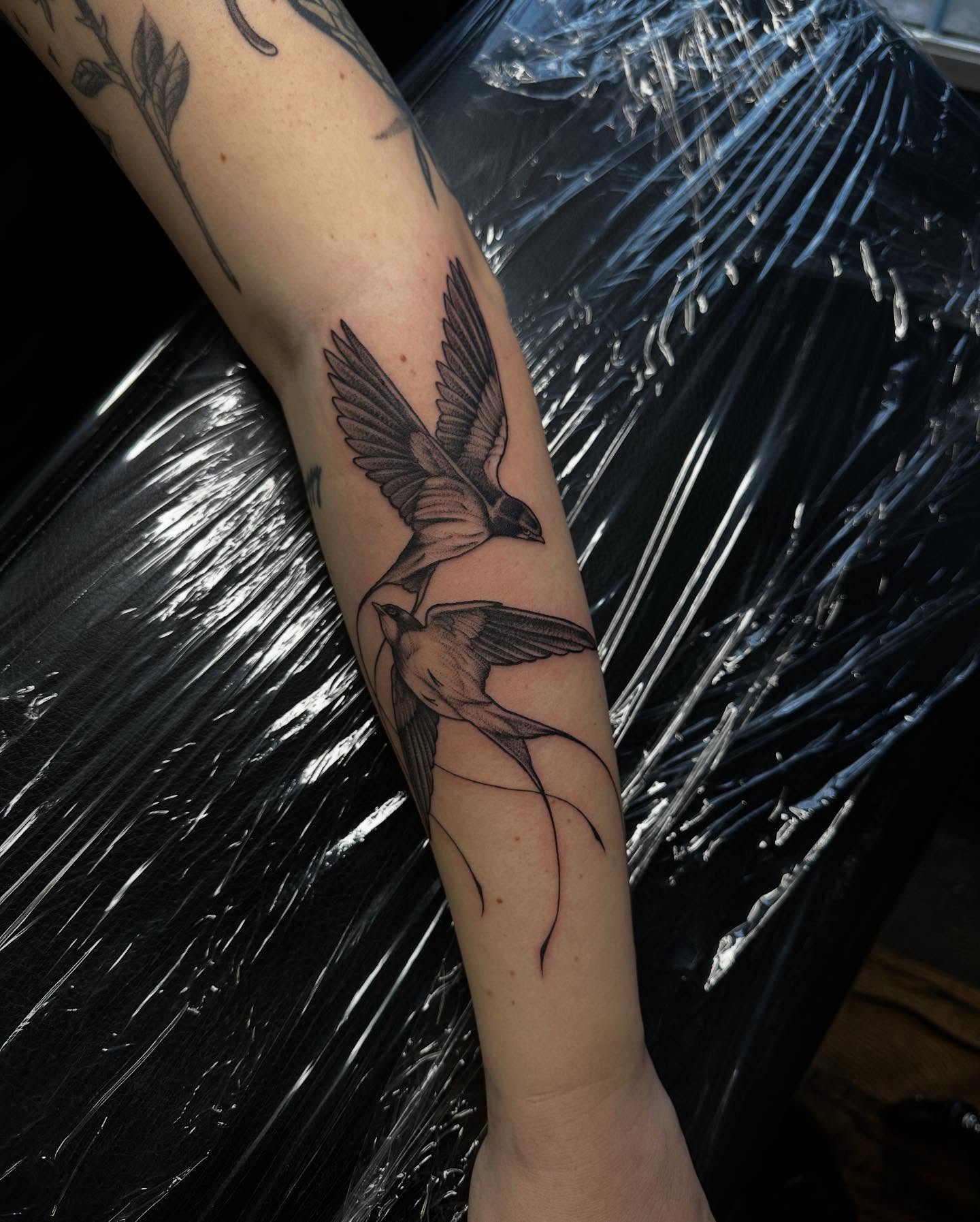 Birds realism tattoo on the forearm by Madison Orchard Tattoos