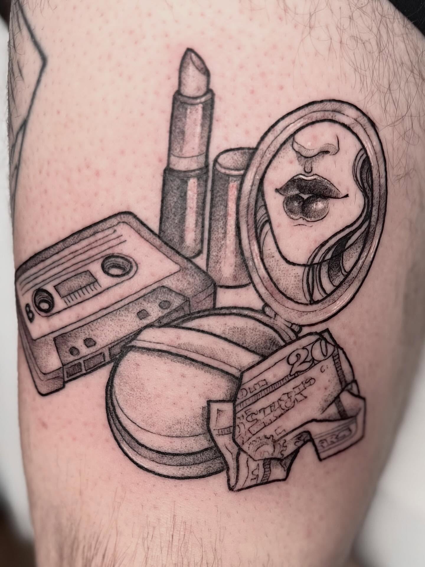 Cosmetics and mirror dotwork tattoo on the thigh by Cincinnati