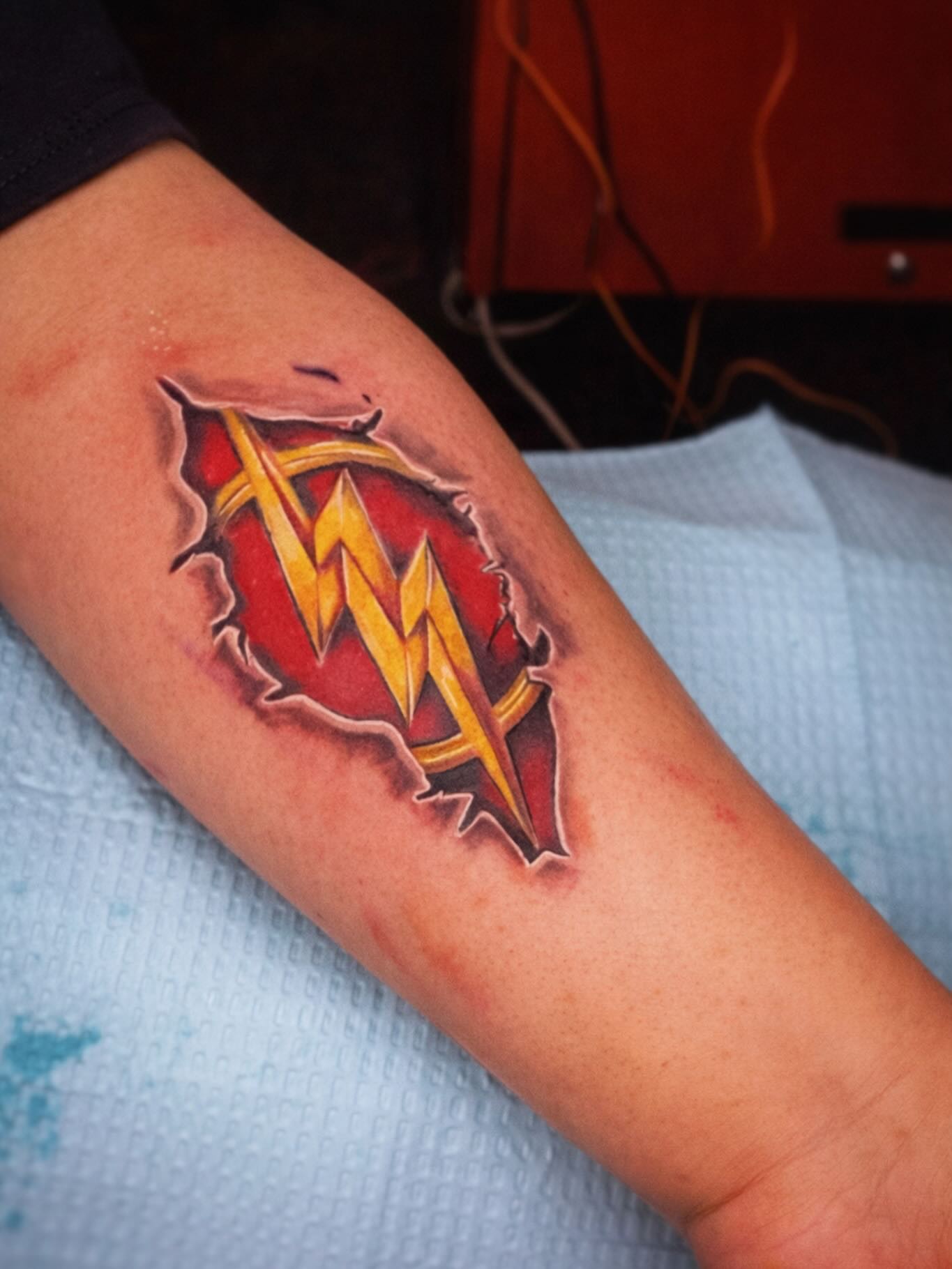WWF logo realism tattoo on the forearm by Shake_tatts