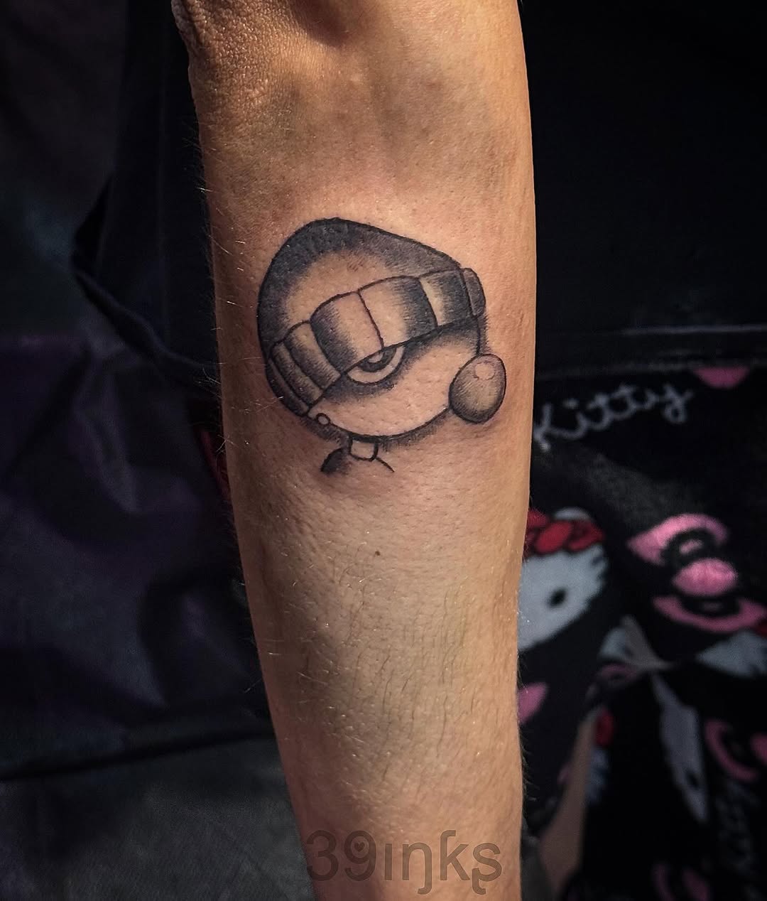 Cartoon character head tattoo on the forearm by Juliette :D