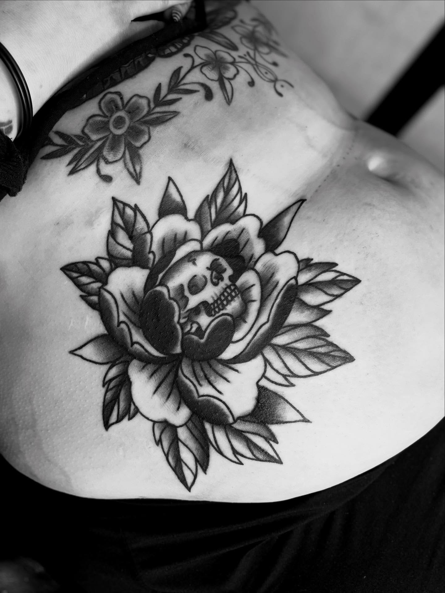 Peony with skull American traditional tattoo by Mim