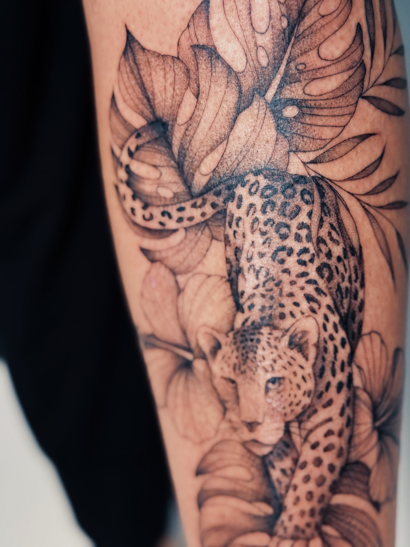 Leopard realism tattoo on the forearm by Olha Tytarenko
