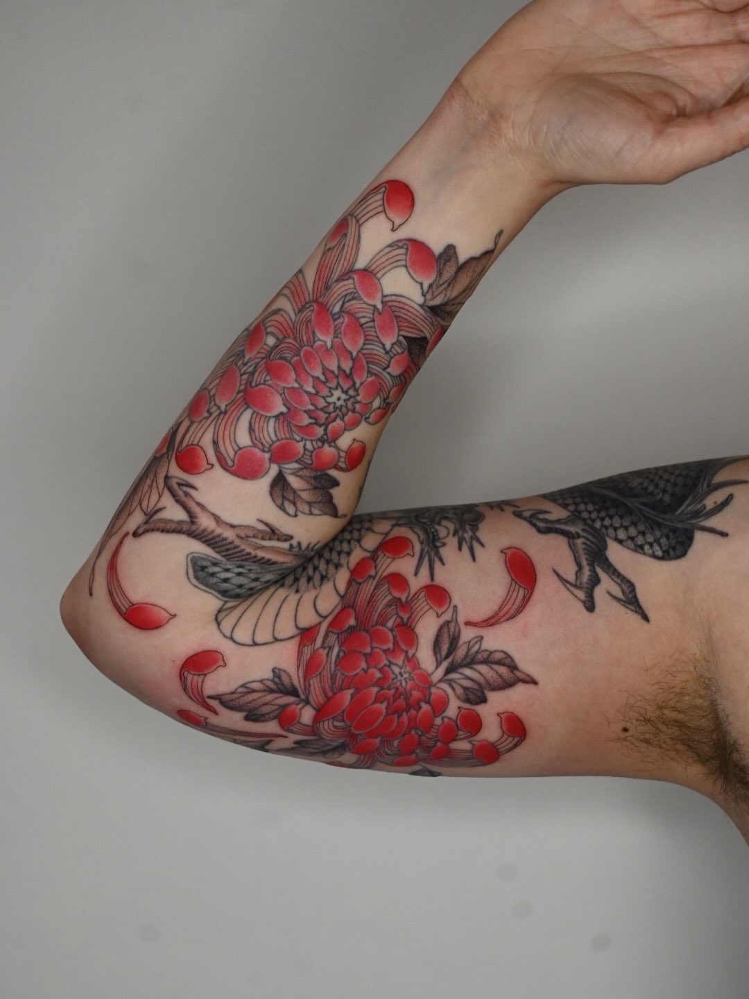 Chrysanthemum and bird japanese irezumi tattoo on the forearm by Simba Nguyen