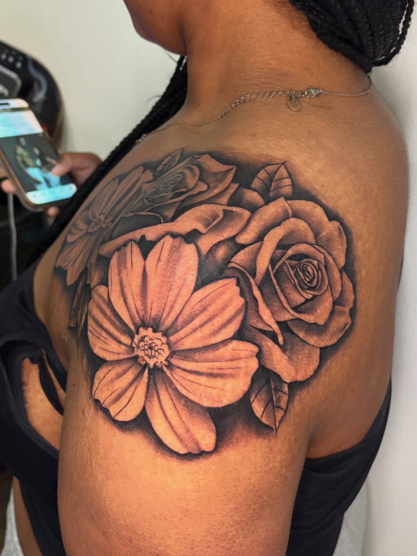 Flowers black and grey tattoo on the shoulder by Osiel Rodriguez