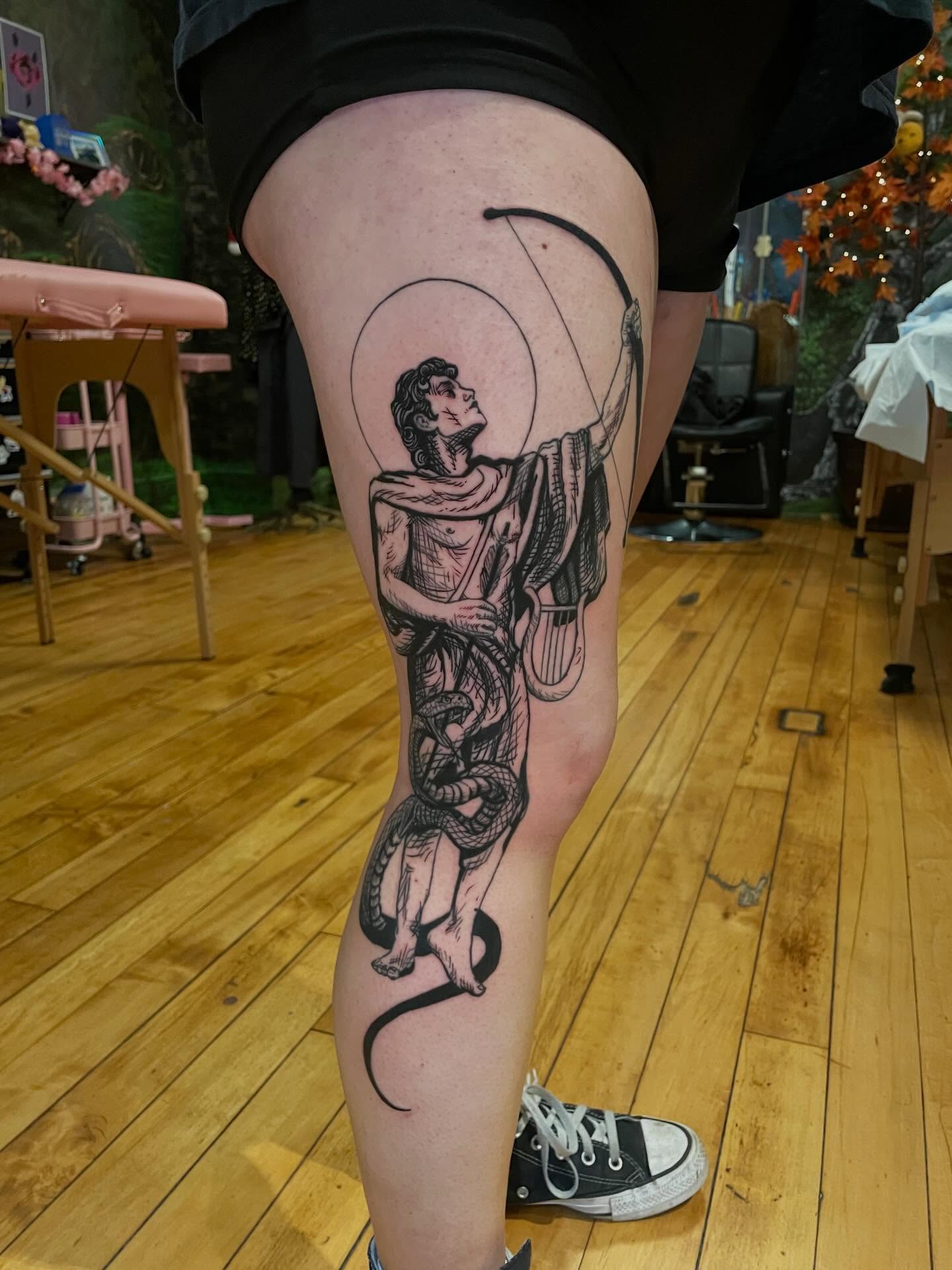 Archer with snake black and grey tattoo on the thigh by Lake Stephens, Richmond, Virginia