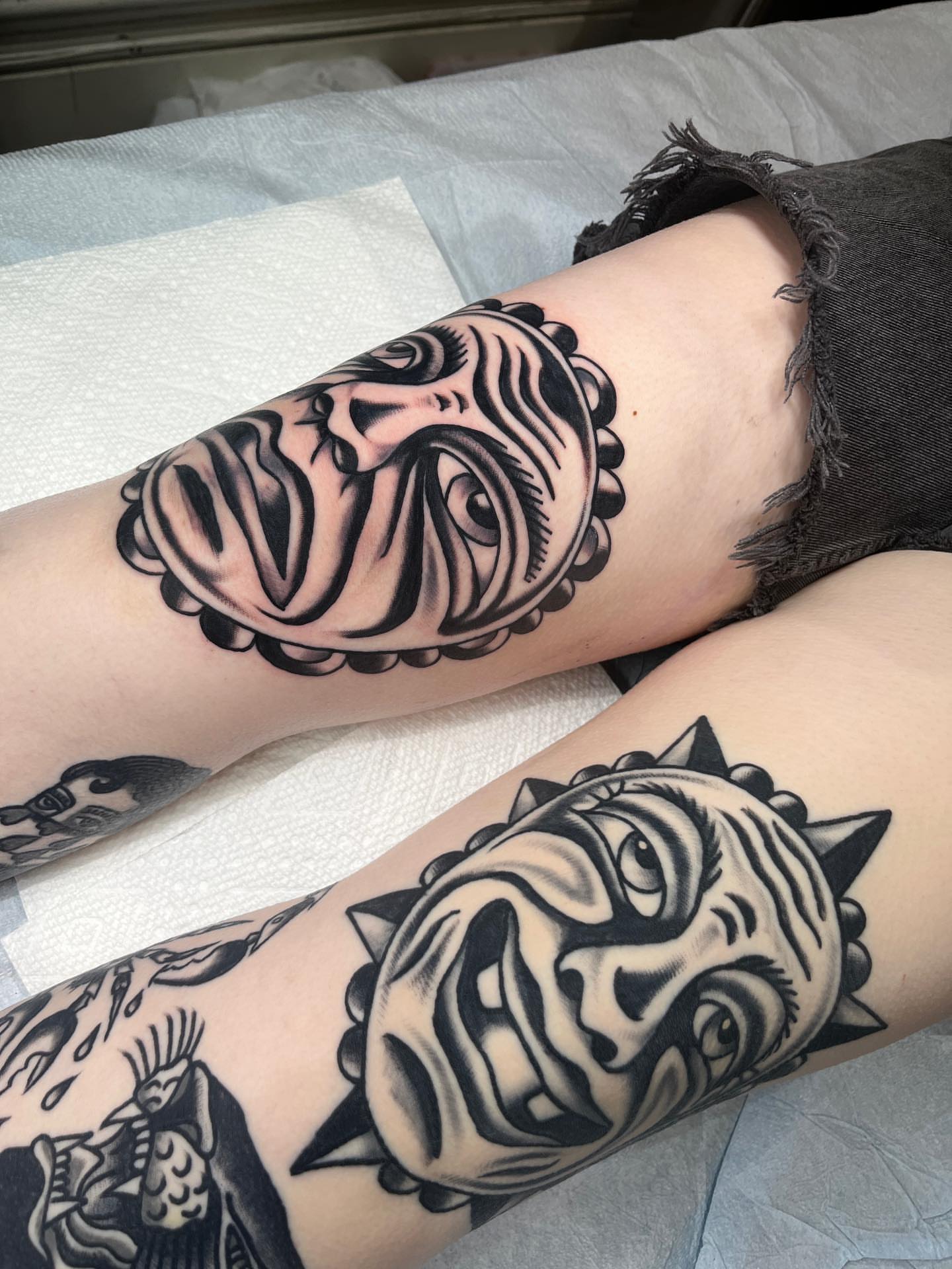 Mask American traditional tattoo on the forearm by Charlie Ostrom, Durham, North Carolina