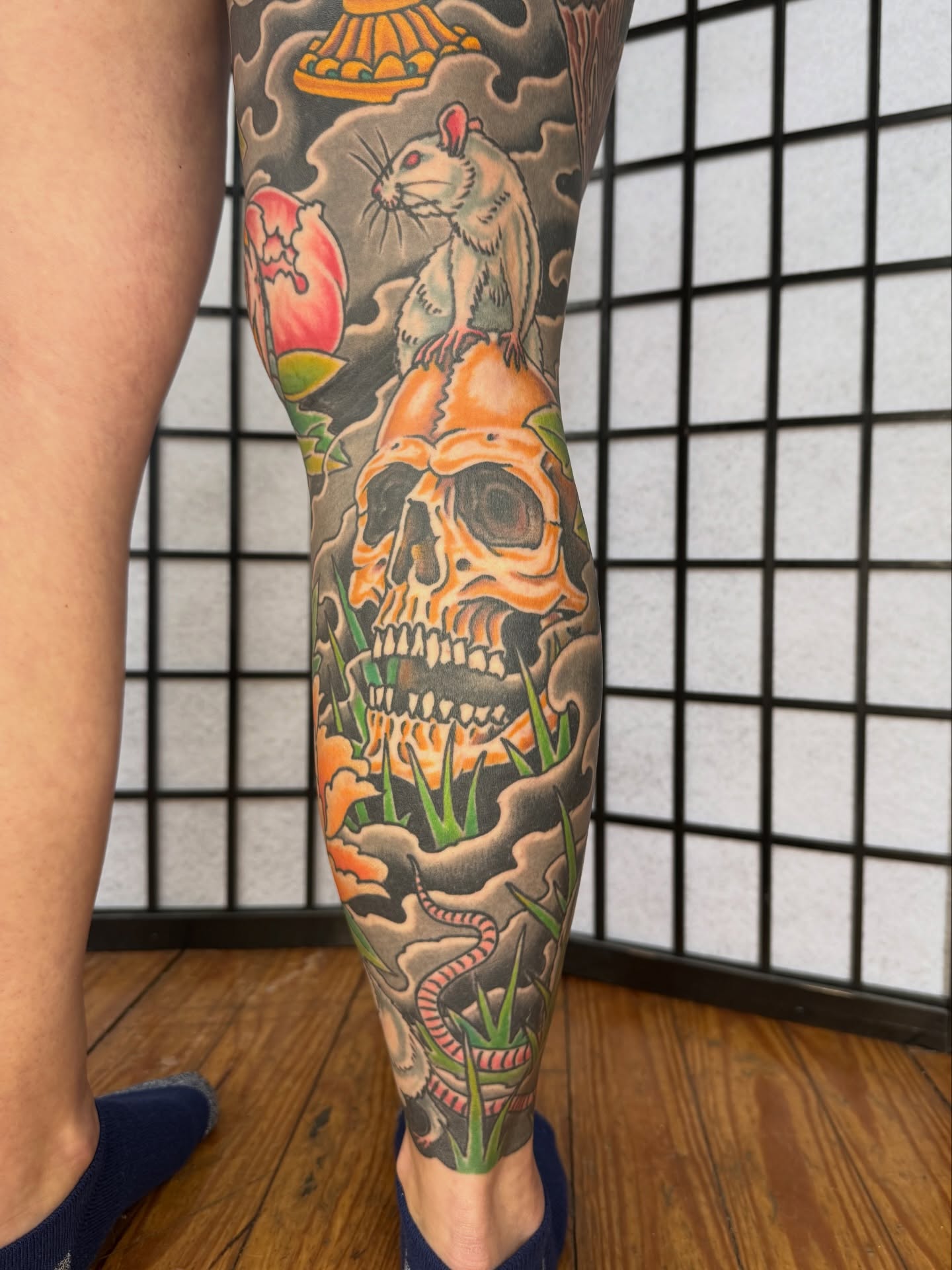 Skull and rat American traditional tattoo on the calf by Zak Colburn