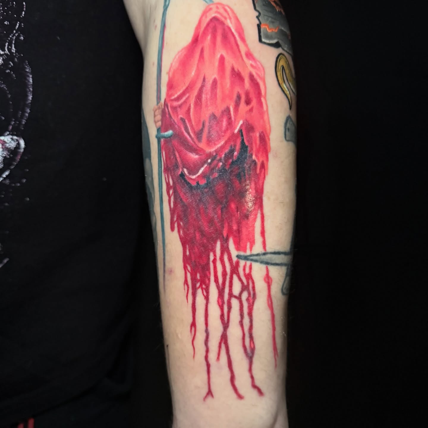 Bleeding angel dark realism tattoo on the forearm by taylor mills