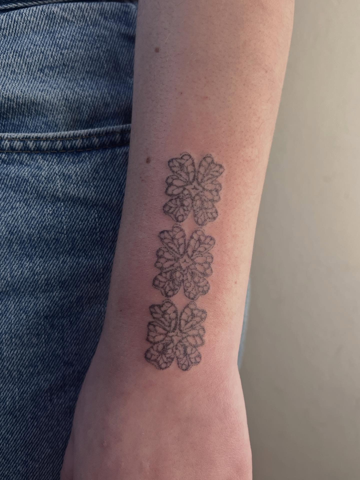 Snowflake black and grey tattoo on the forearm by faith