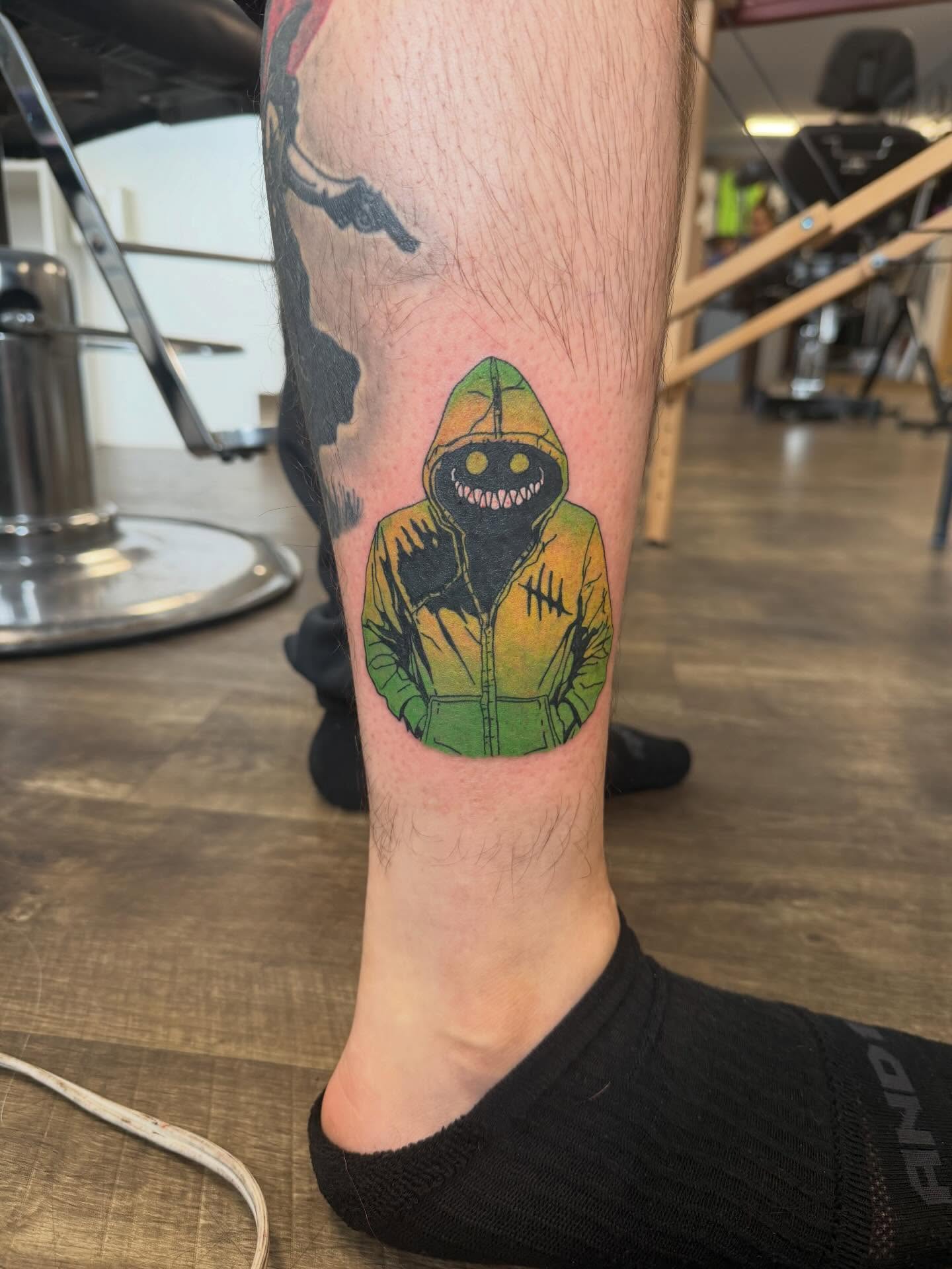 Hoodie monster dotwork tattoo on the calf by Hope Powell, Vancouver, Washington