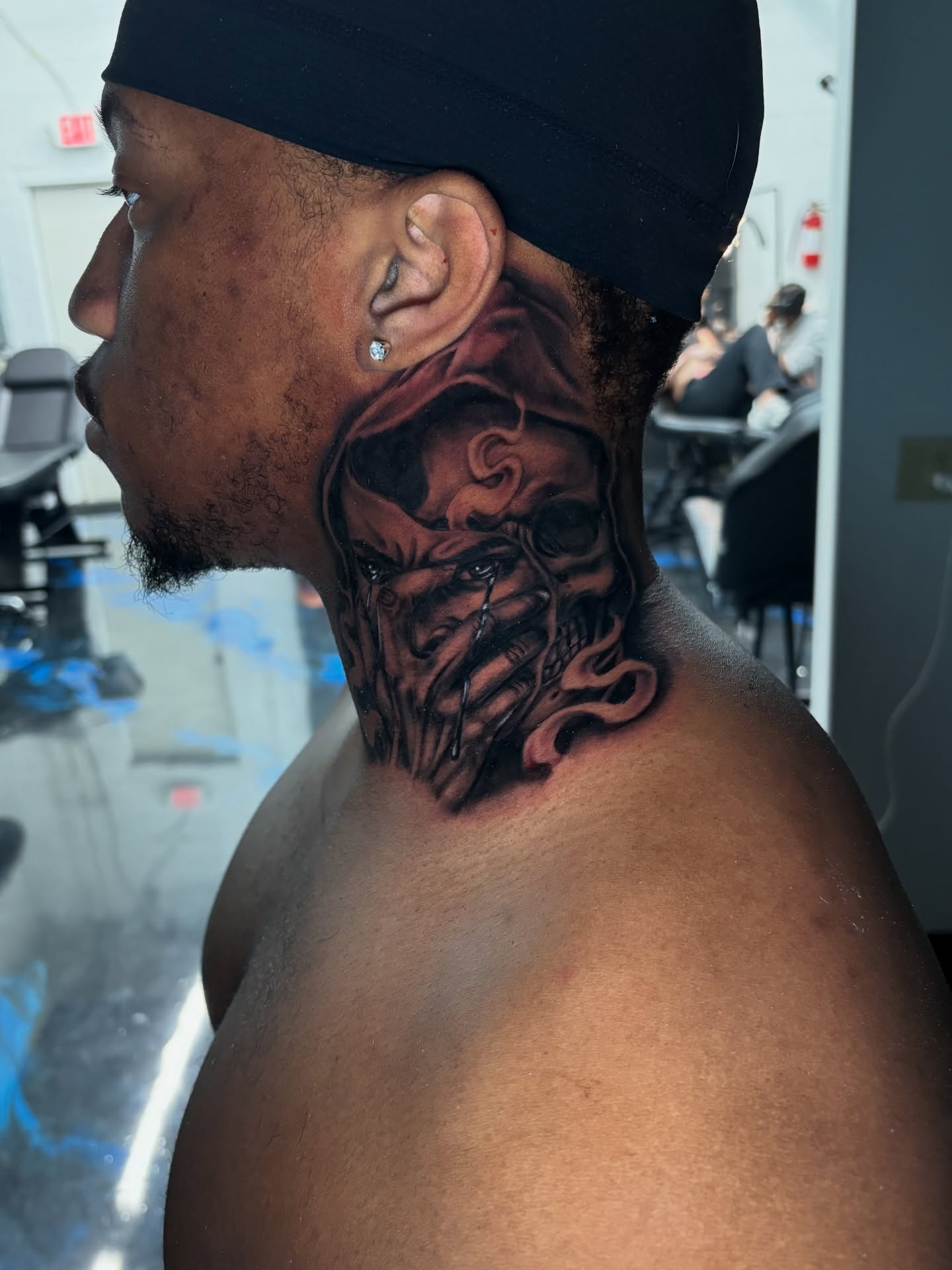 Mask realism tattoo on the neck by Vonte Seay