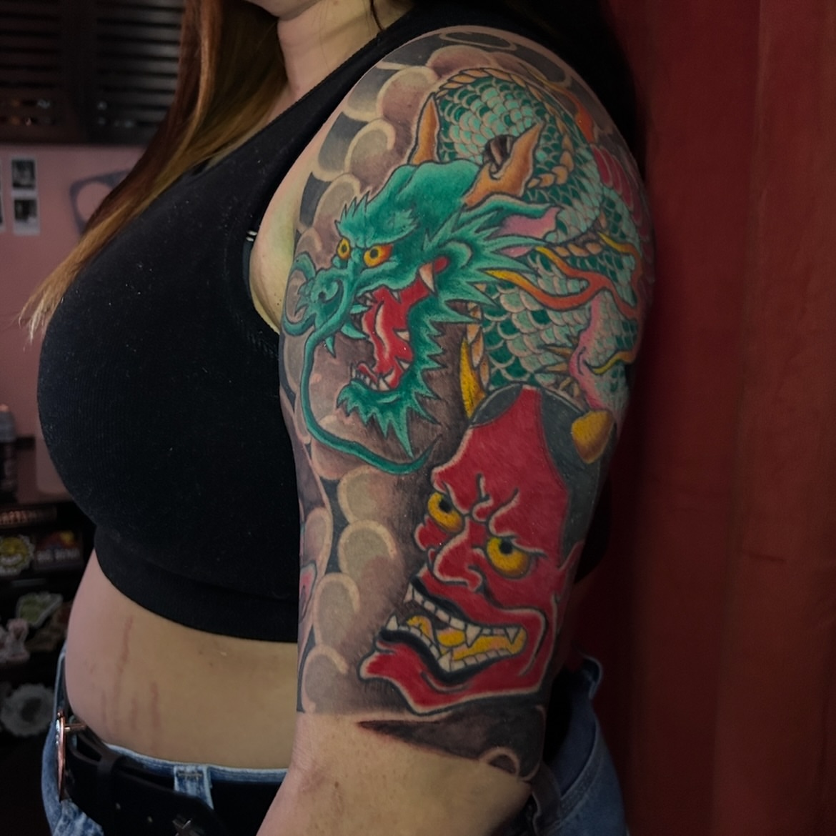 Dragon and mask japanese irezumi tattoo on the upper arm by Kat McCoy Guidera, Nashville, Tennessee