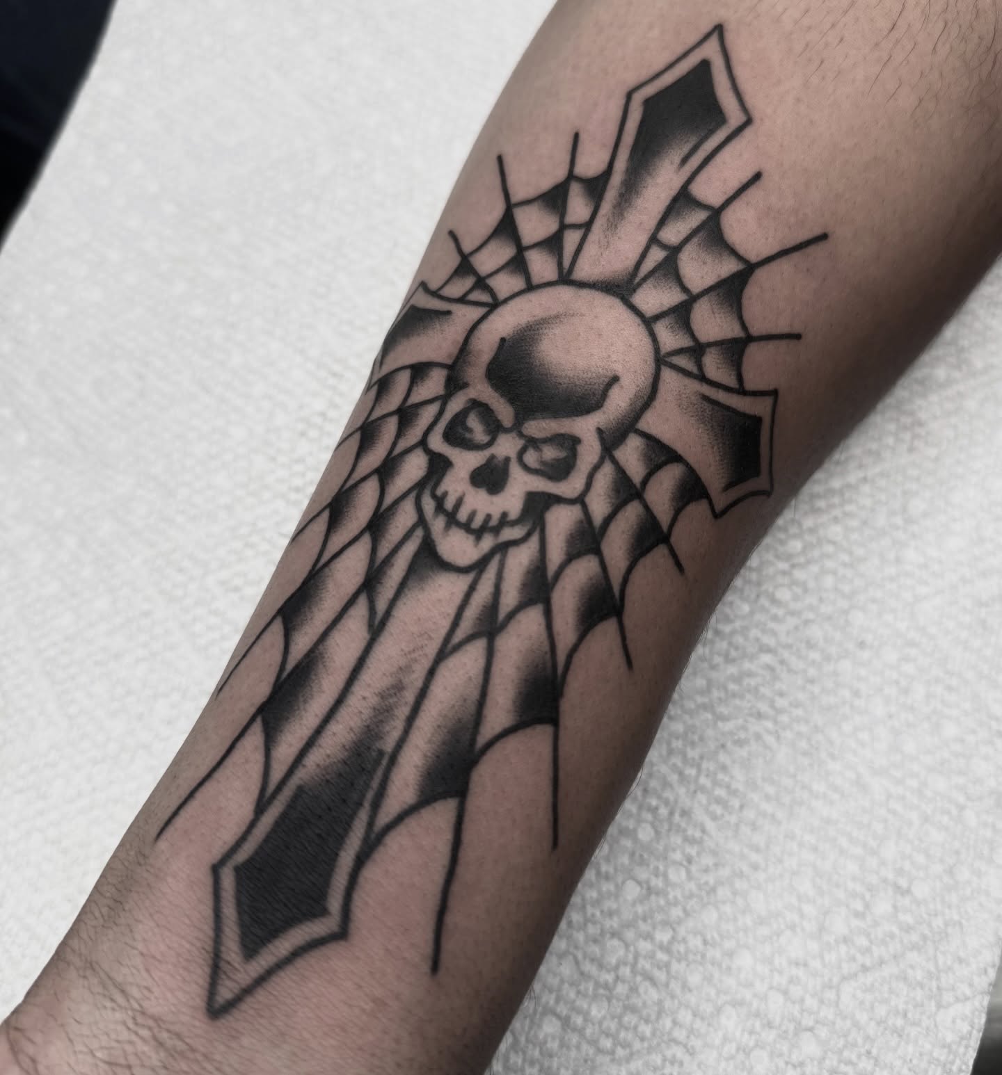 Skull and cross black and grey tattoo on the forearm by Drew🕸️, Phoenix, Arizona
