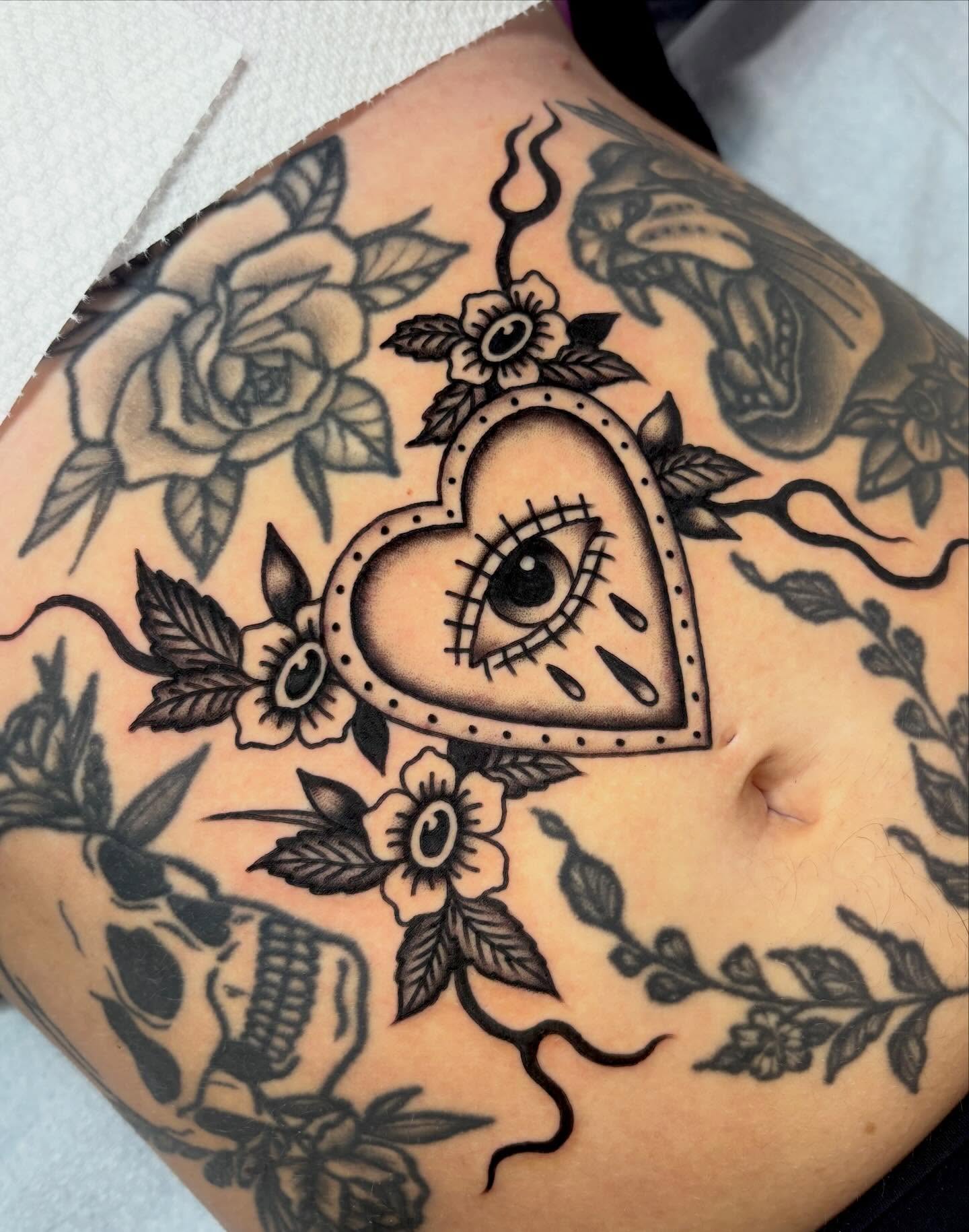Heart with eye American traditional tattoo on the torso by sally ★ lee