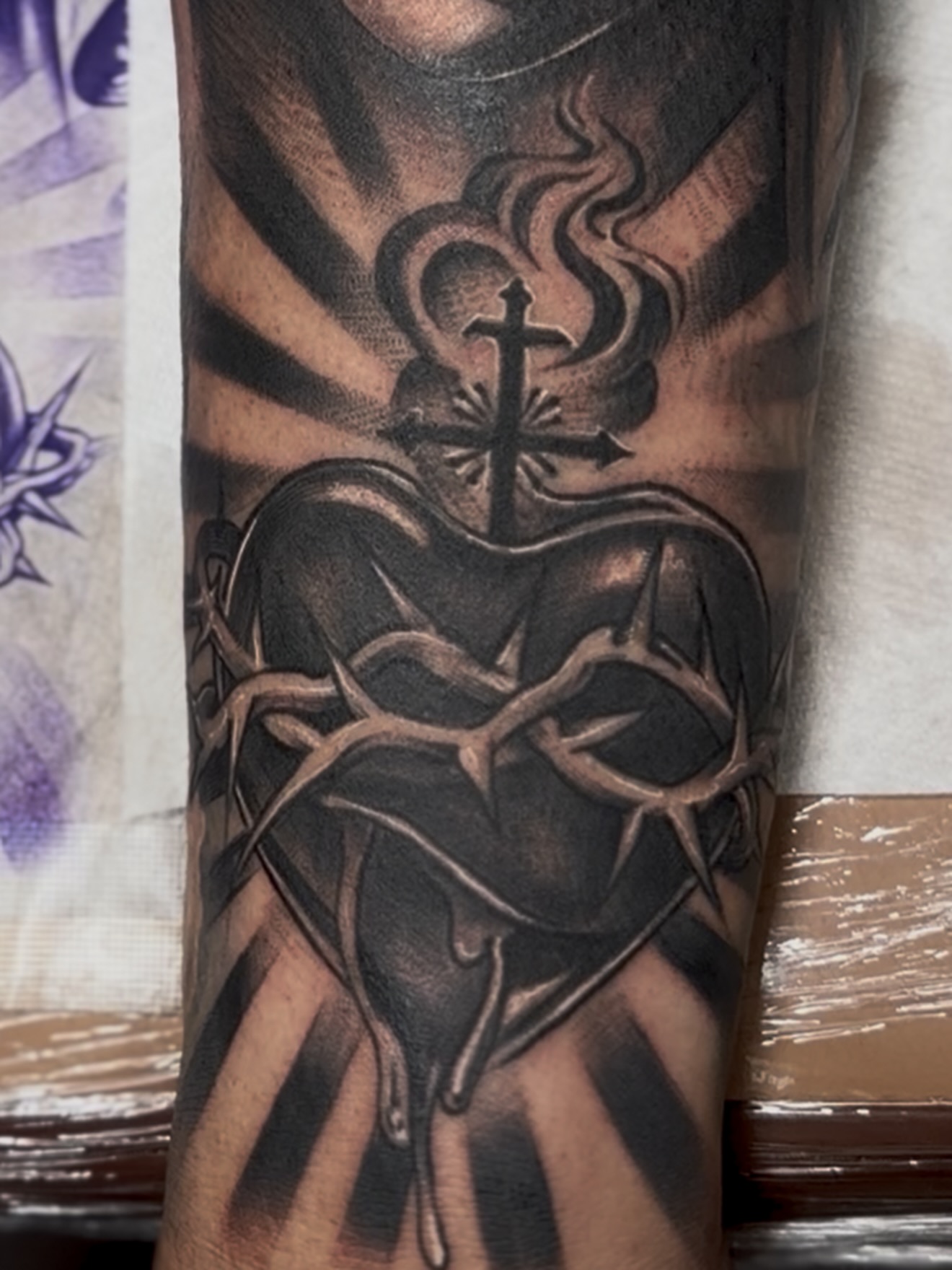 Heart and cross realism tattoo on the forearm by Raul Rodriguez