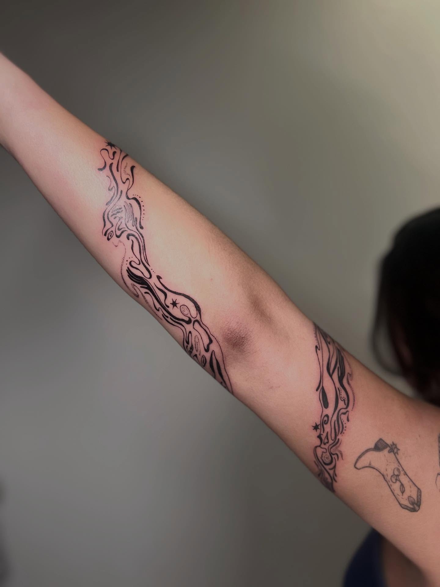 Abstract flames black and grey tattoo on the forearm by Alex